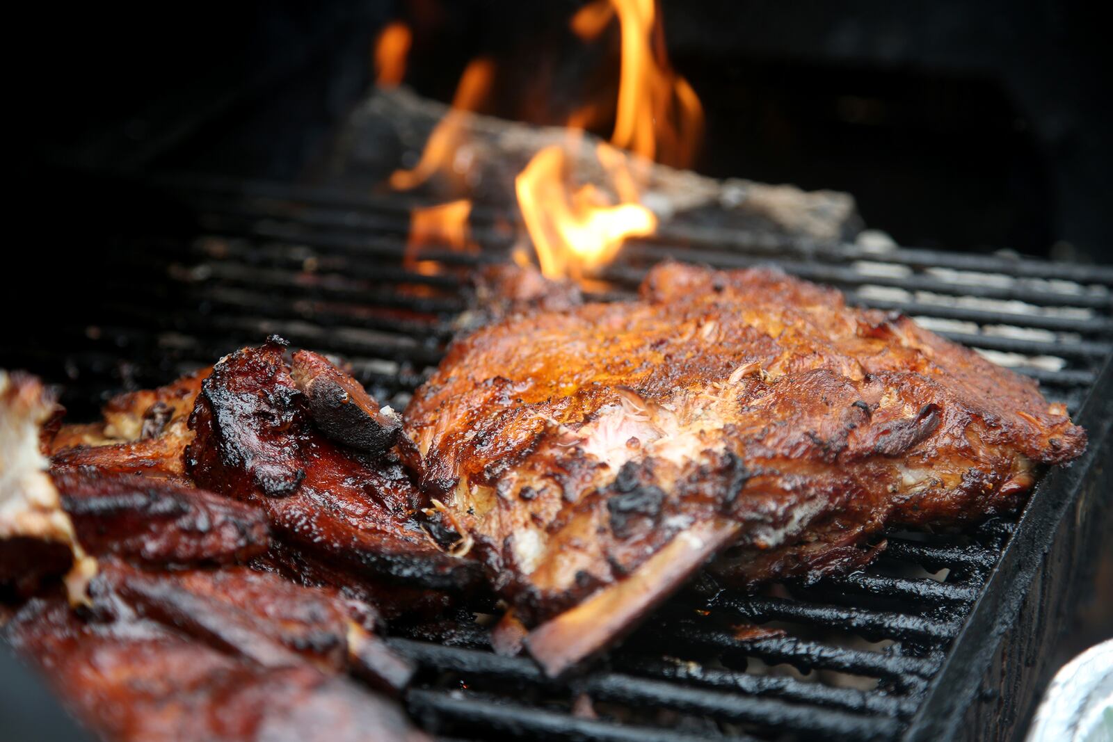 Guy C. Ansley smokes ribs each Friday and by request. Ansley founded Courtland’s Mobile Grill in 2006. He is a staple on Courthouse Square and around Dayton and is known for his ribs, fish, wings and tenders. LISA POWELL / STAFF