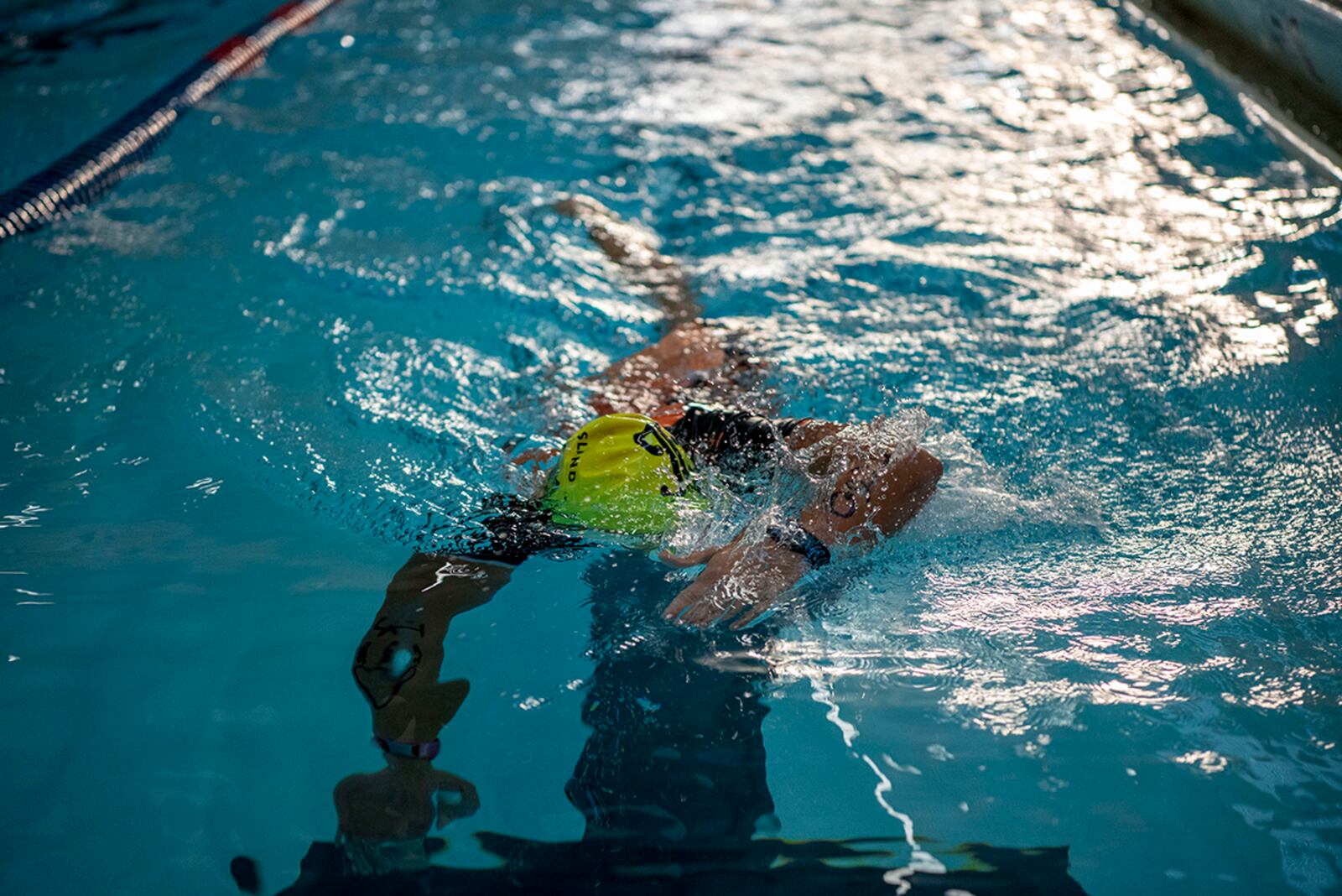 A sprint triathlon competitor participates in the 750-yard swim Sept. 11 at Dodge Fitness Center on Wright-Patterson Air Force Base. Participants completed a 750-yard swim, 20K bike ride and 5K run. U.S. AIR FORCE PHOTO/STAFF SGT. MIKALEY KLINE