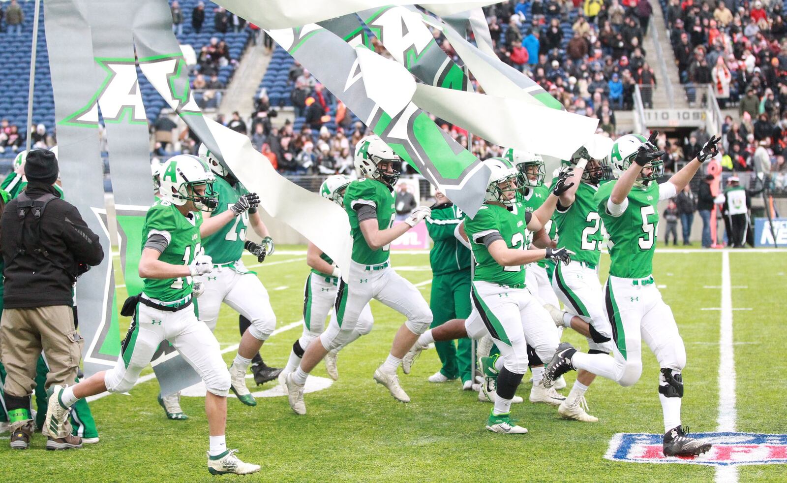 The Anna Rockets take the field for Friday’s Division VI state championship game at Tom Benson Hall of Fame Stadium in Canton. Marc Pendleton/STAFF