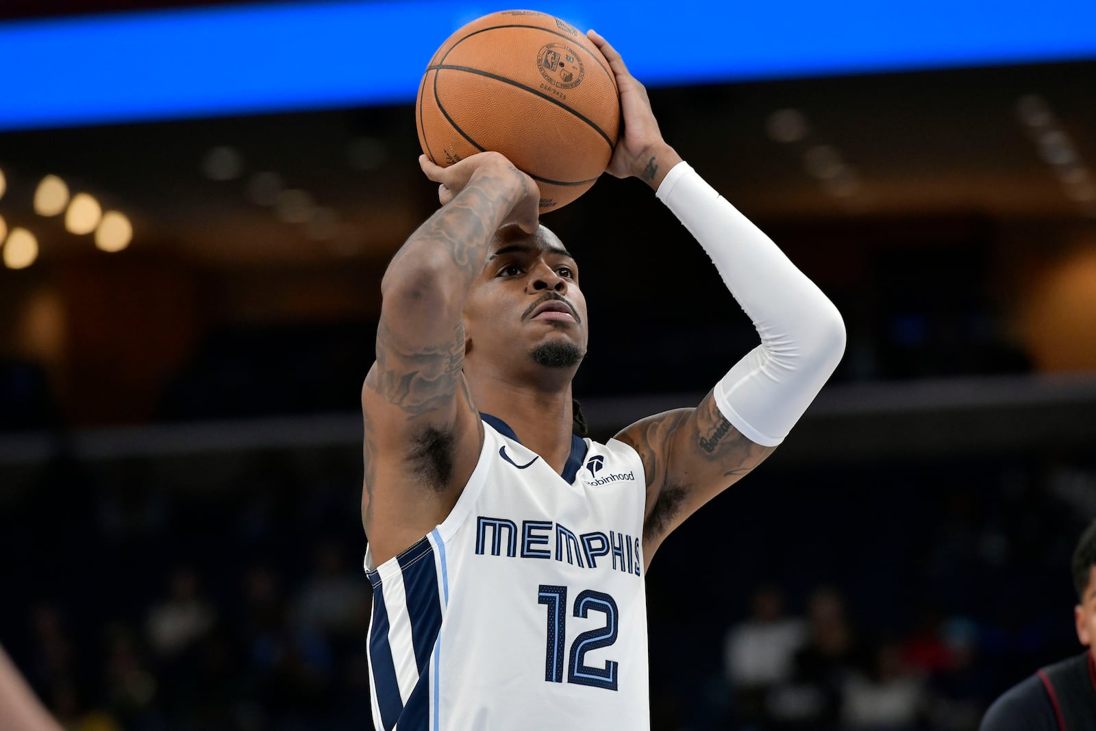 Memphis Grizzlies guard Ja Morant prepares to shoot a free throw in the first half of an NBA preseason basketball game against the Miami Heat, Friday, Oct. 18, 2024, in Memphis, Tenn. (AP Photo/Brandon Dill)