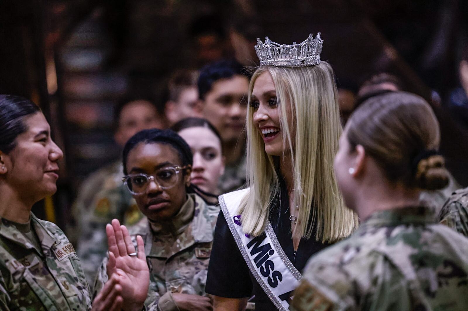 Miss America 2024 and a USAF airman Madison Marsh meets and greets other airmen at US Air Force Museum Tuesday March 19, 2024. Marsh was in Dayton to speak to STEM students and attend the NCAA First Four games at UD Arena. JIM NOELKER/STAFF