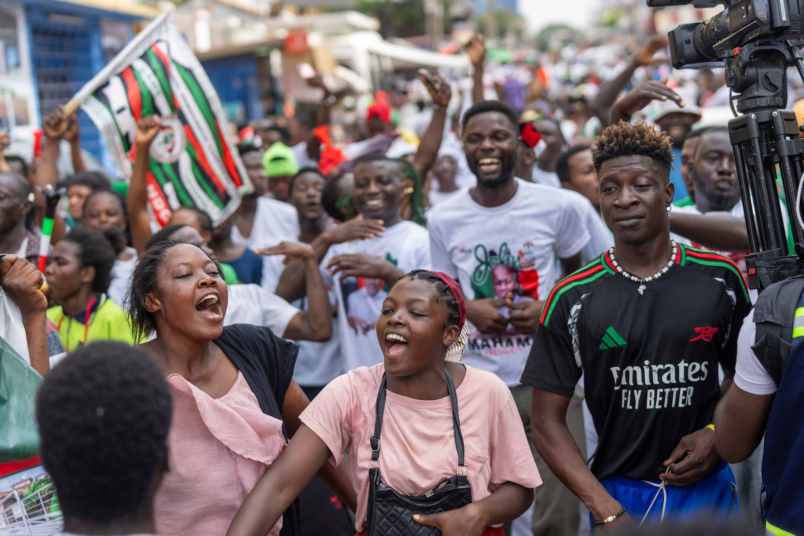 Supporters of opposition candidate and former President John Dramani Mahama celebrate his victory after his opponent Ghana’s vice president and ruling party candidate, Mahamudu Bawumia conceded in Accra, Ghana, Sunday, December 8, 2024. (AP Photo/Jerome Delay)