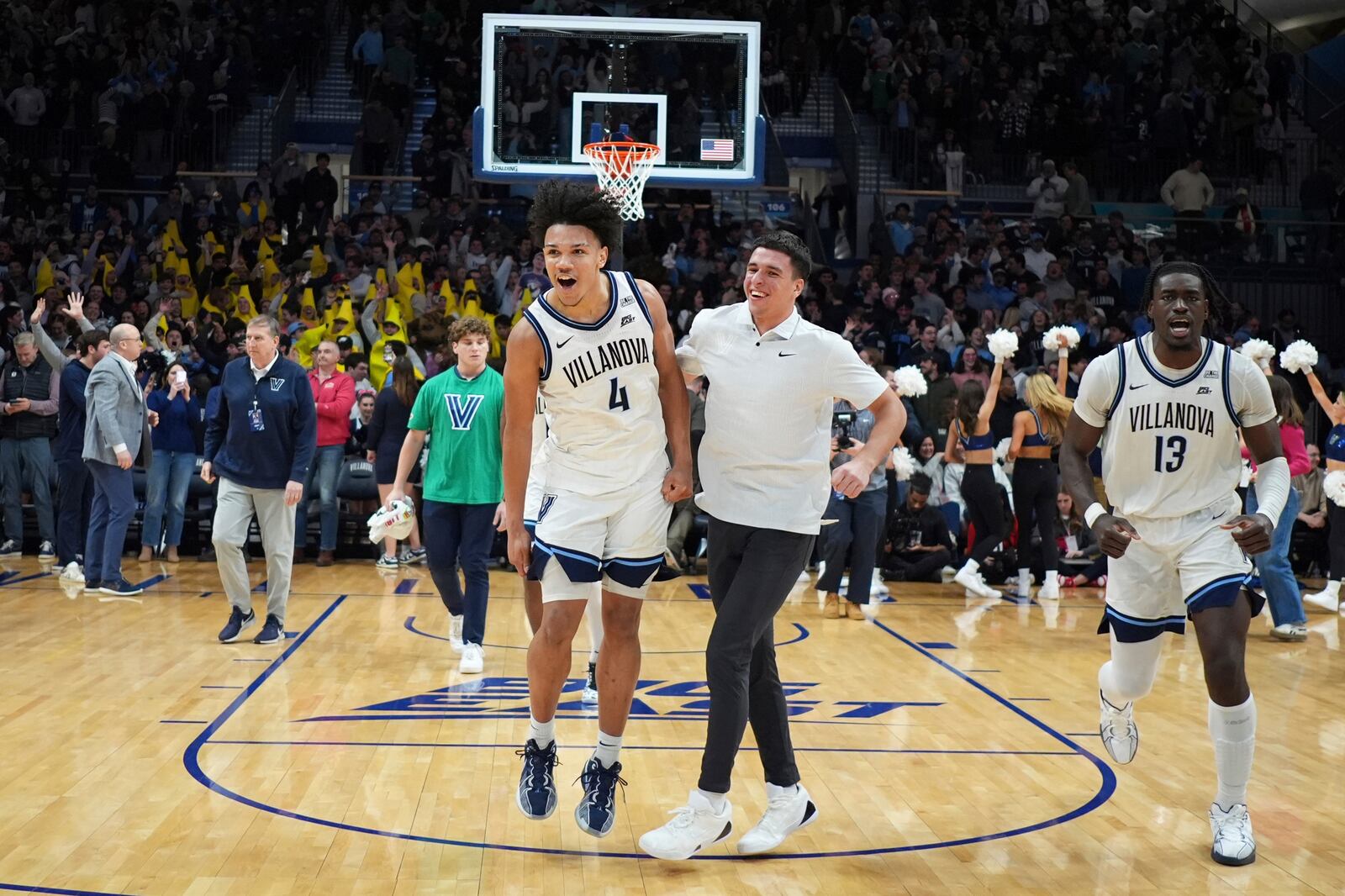 Villanova's Tyler Perkins (4) and Enoch Boakye (13) celebrate after Villanova won an NCAA college basketball game against St. John's, Wednesday, Feb. 12, 2025, in Villanova, Pa. (AP Photo/Matt Slocum)