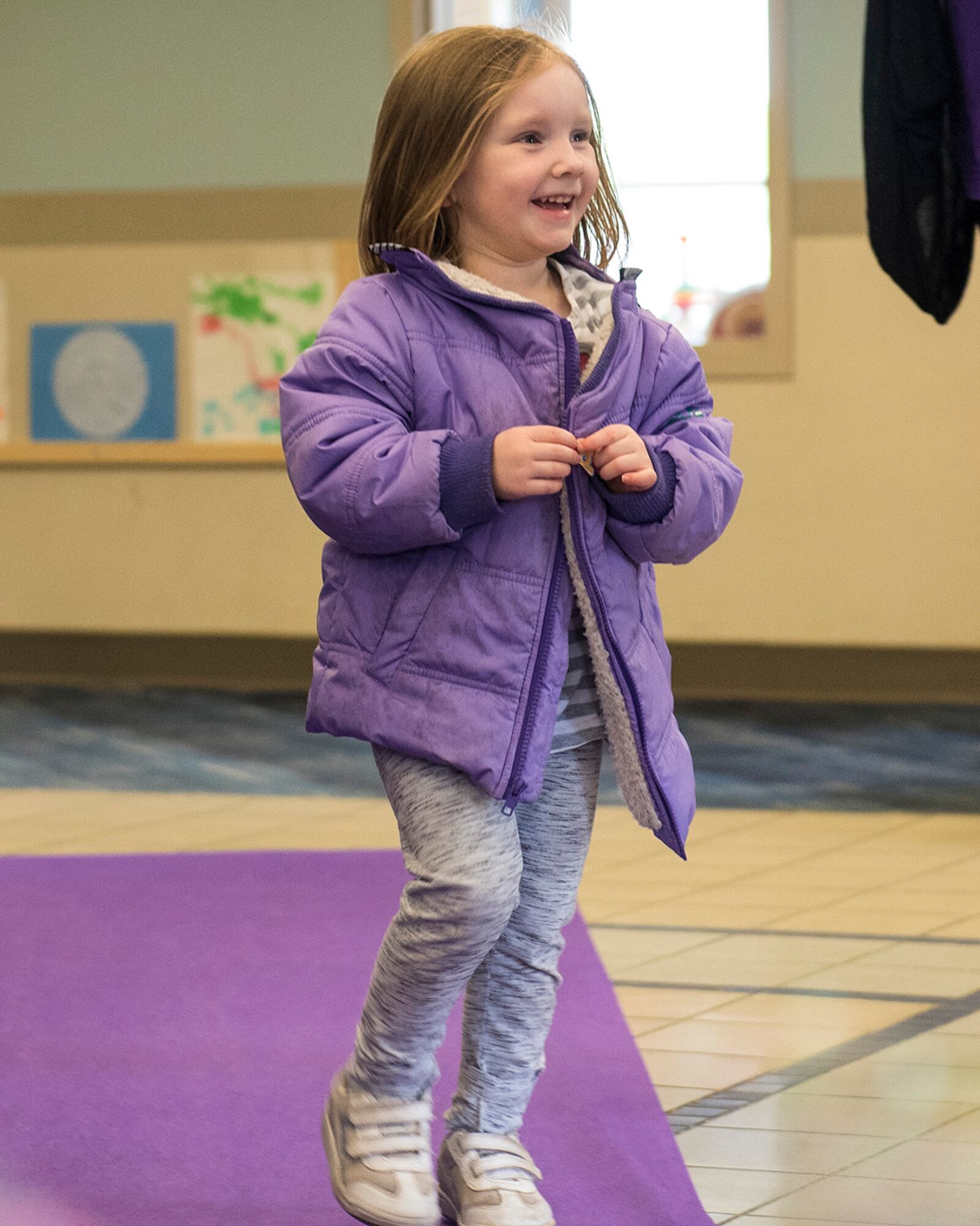 A child walks the purple carpet at the Wright Field South Child Development Center on April 29 at Wright-Patterson Air Force Base. Children were celebrated with the bubbles, music and the opportunity to walk the purple carpet in honor of the Month of the Military Child. U.S. AIR FORCE PHOTO/JAIMA FOGG