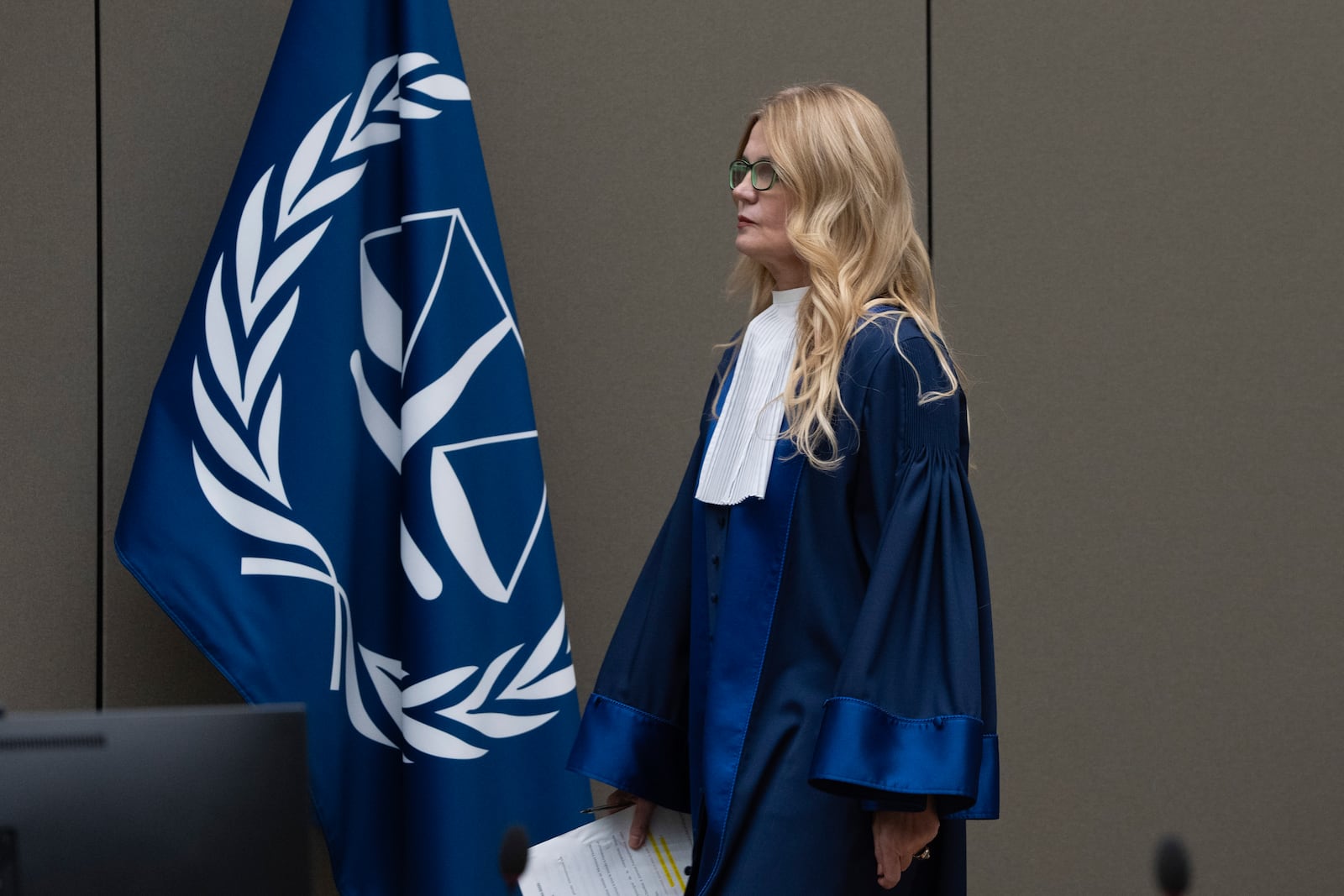 Presiding judge Iulia Antoanella Motoc enters the courtroom where Former Philippine President Rodrigo Duterte appeared by video link before the International Criminal Court (ICC) in The Hague, Netherlands, Friday, March 14, 2025. (AP Photo/Peter Dejong, Pool)