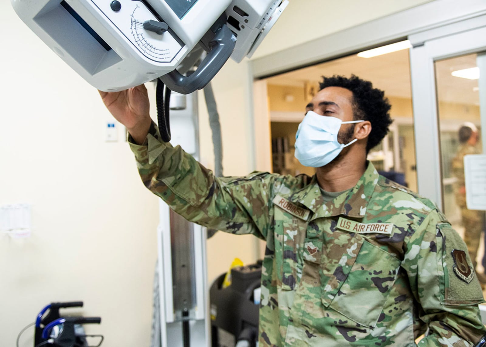 Senior Airman Jikhail Robinson, a radiologic technologist with the 88th Medical Group, takes a portable chest X-ray of a patient inside the emergency room of the Wright-Patterson Medical Center April 28. U.S. AIR FORCE PHOTO/WESLEY FARNSWORTH