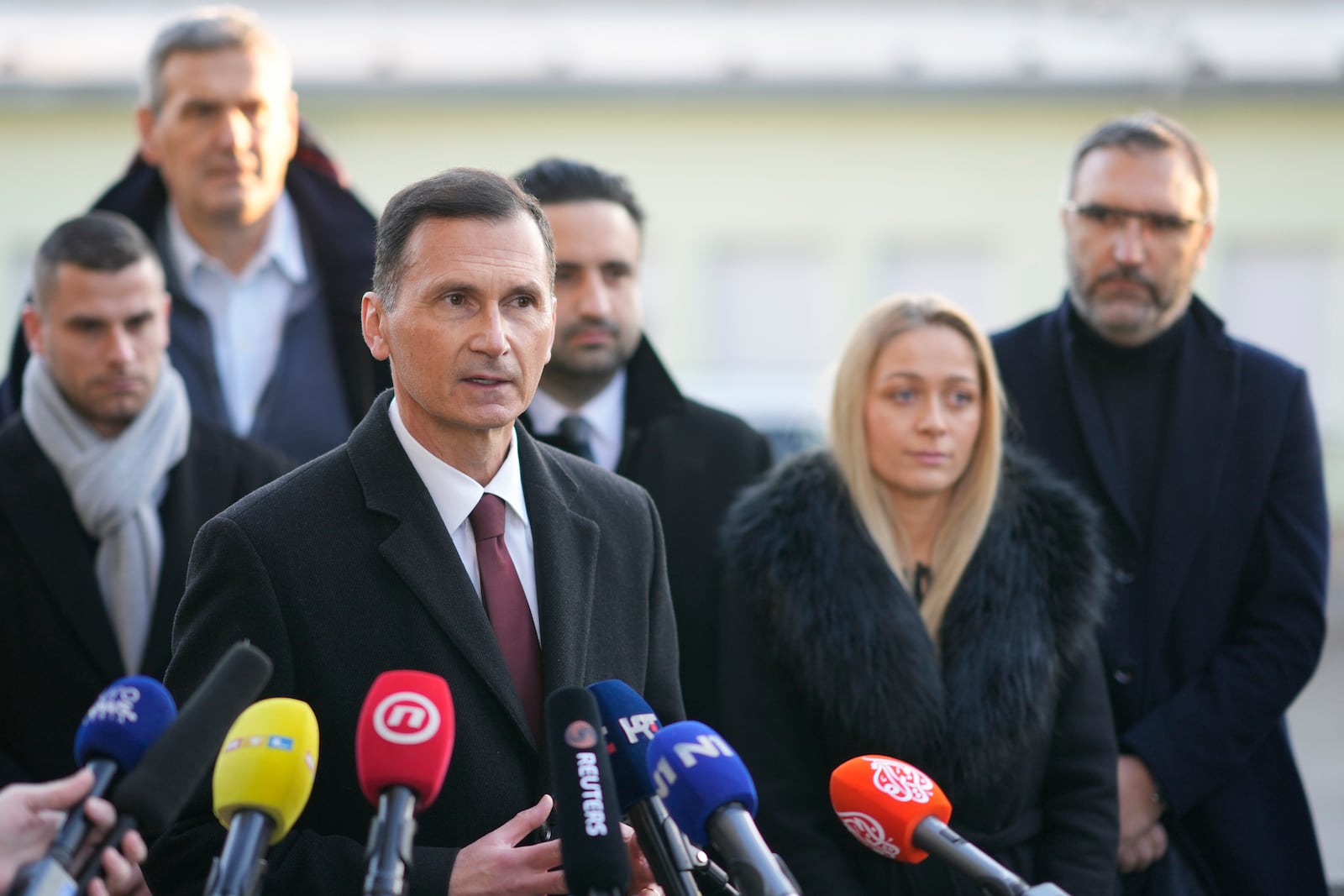 Dragan Primorac, the candidate of the ruling Croatian Democratic Union (HDZ) speaks to the media after casting his ballot during a presidential election at a polling station in Zagreb, Croatia, Sunday, Dec. 29, 2024. (AP Photo/Darko Bandic)