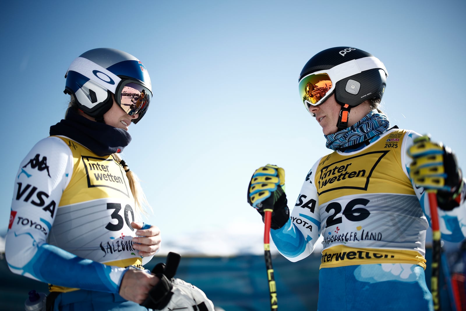 United States' Lindsey Vonn, left, and Breezy Johnson get ready to start an alpine ski, women's World Championship downhill training, in Saalbach-Hinterglemm, Austria, Tuesday, Feb. 4, 2025. (AP Photo/Gabriele Facciotti)