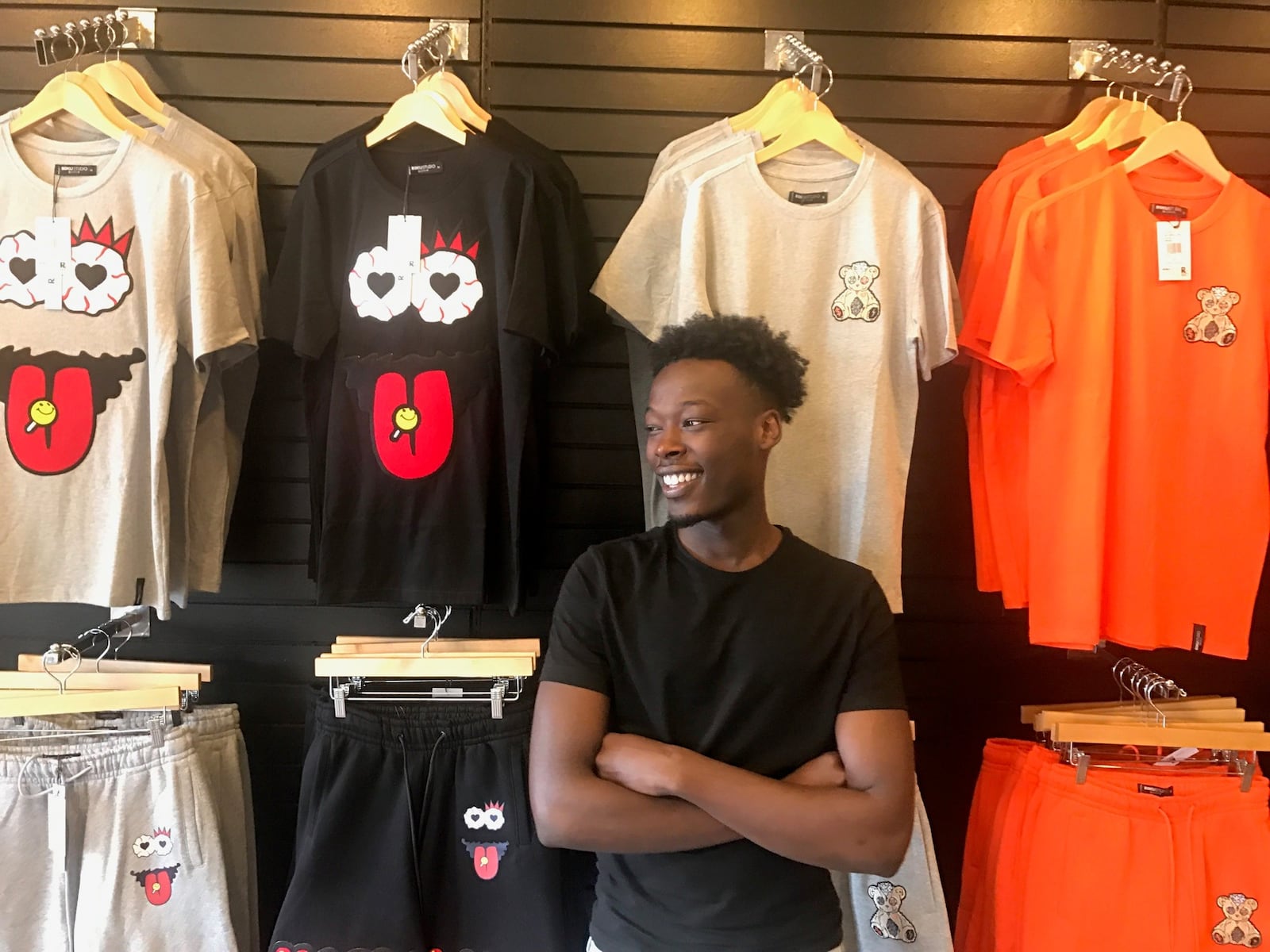 Mustafa Ibrahim in the 48th Clothing store he and former Belmont High soccer teammate Herbert Chongwain opened two months ago in the Northwest Plaza off Siebenthaler Avenue. Tom Archdeacon/STAFF