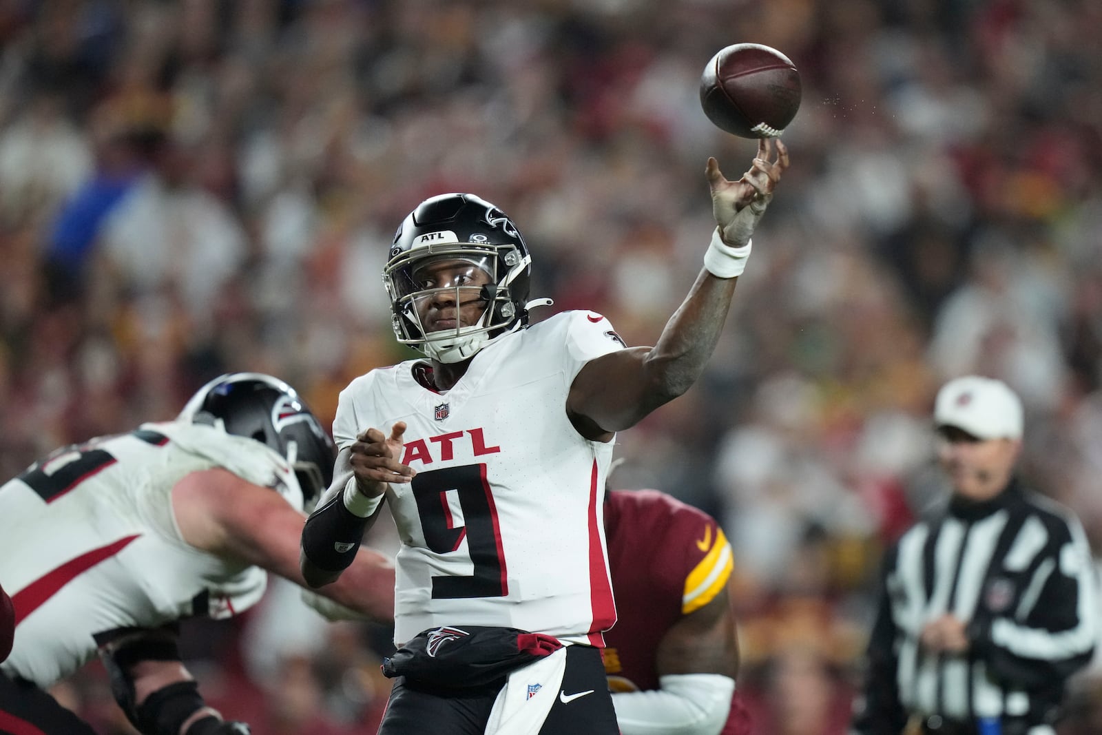 Atlanta Falcons quarterback Michael Penix Jr. (9) passes during the first half of an NFL football game against the Washington Commanders, Sunday, Dec. 29, 2024, in Landover. (AP Photo/Stephanie Scarbrough)