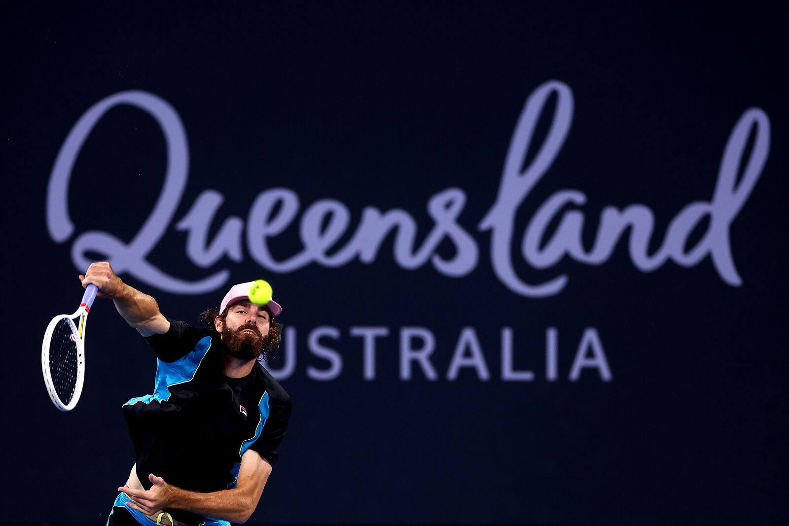 USA's Reilly Opelka plays serves to Serbia's Novak Djokovic during their match at the Brisbane International, in Brisbane, Australia, Friday, Jan. 3, 2025. (AP Photo/Pat Hoelscher)