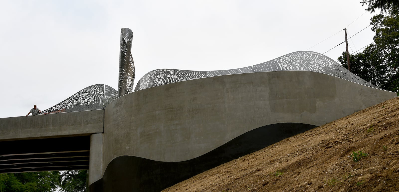  “Foliage,” a new Kettering public artwork, has been installed on the Ridgeway Road bridge. The stainless steel sculpture designed by Cliff Garten Studio in Venice, CA, mimics the landscape found within Hills & Dales MetroPark and Kettering. SHAYNA MCCONVILLE / CITY OF KETTERING