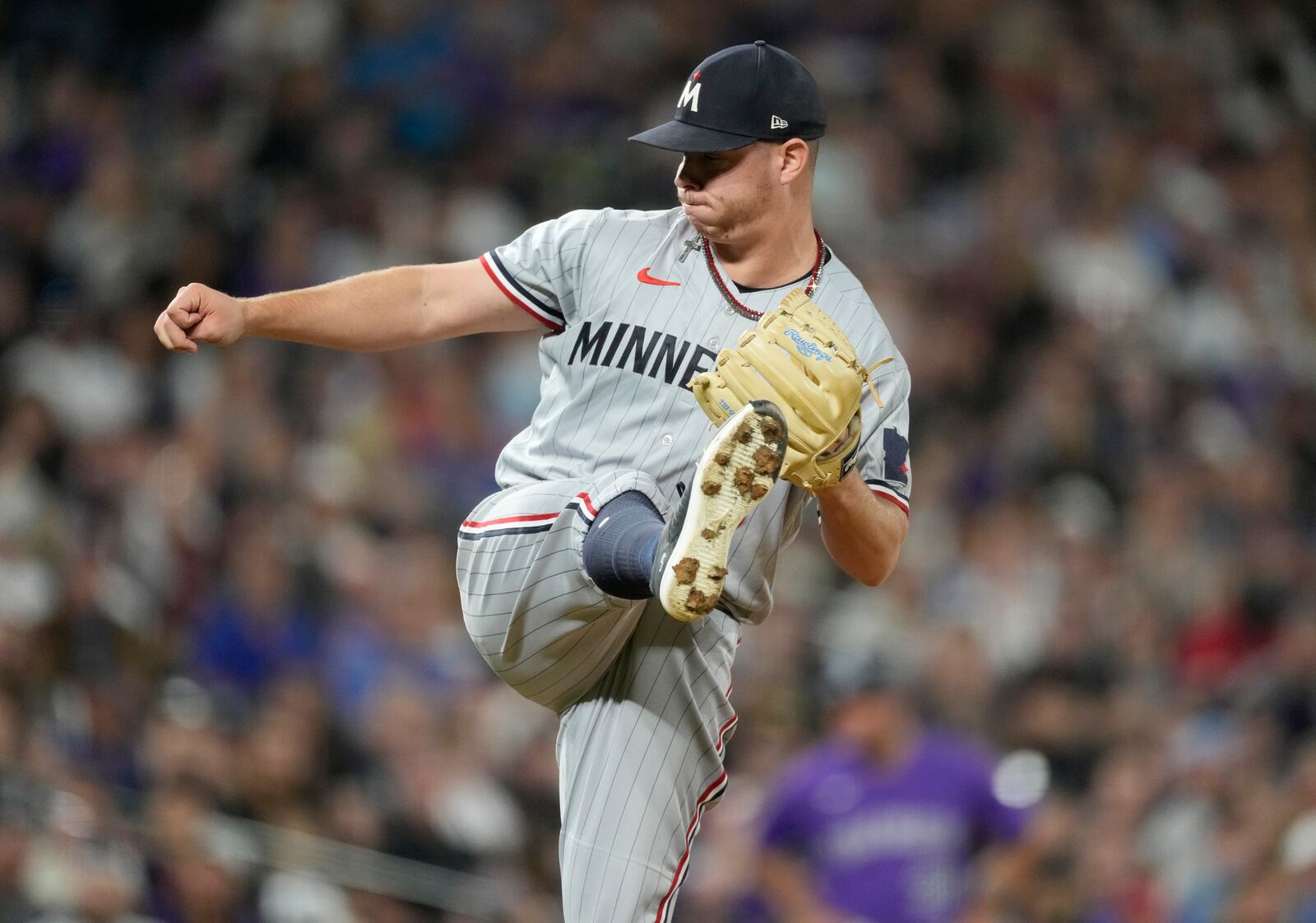 Minnesota Twins relief pitcher Emilio Pagan works against Colorado Rockies' Nolan Jones in the ninth inning of a baseball game Friday, Sept. 29, 2023, in Denver. (AP Photo/David Zalubowski)