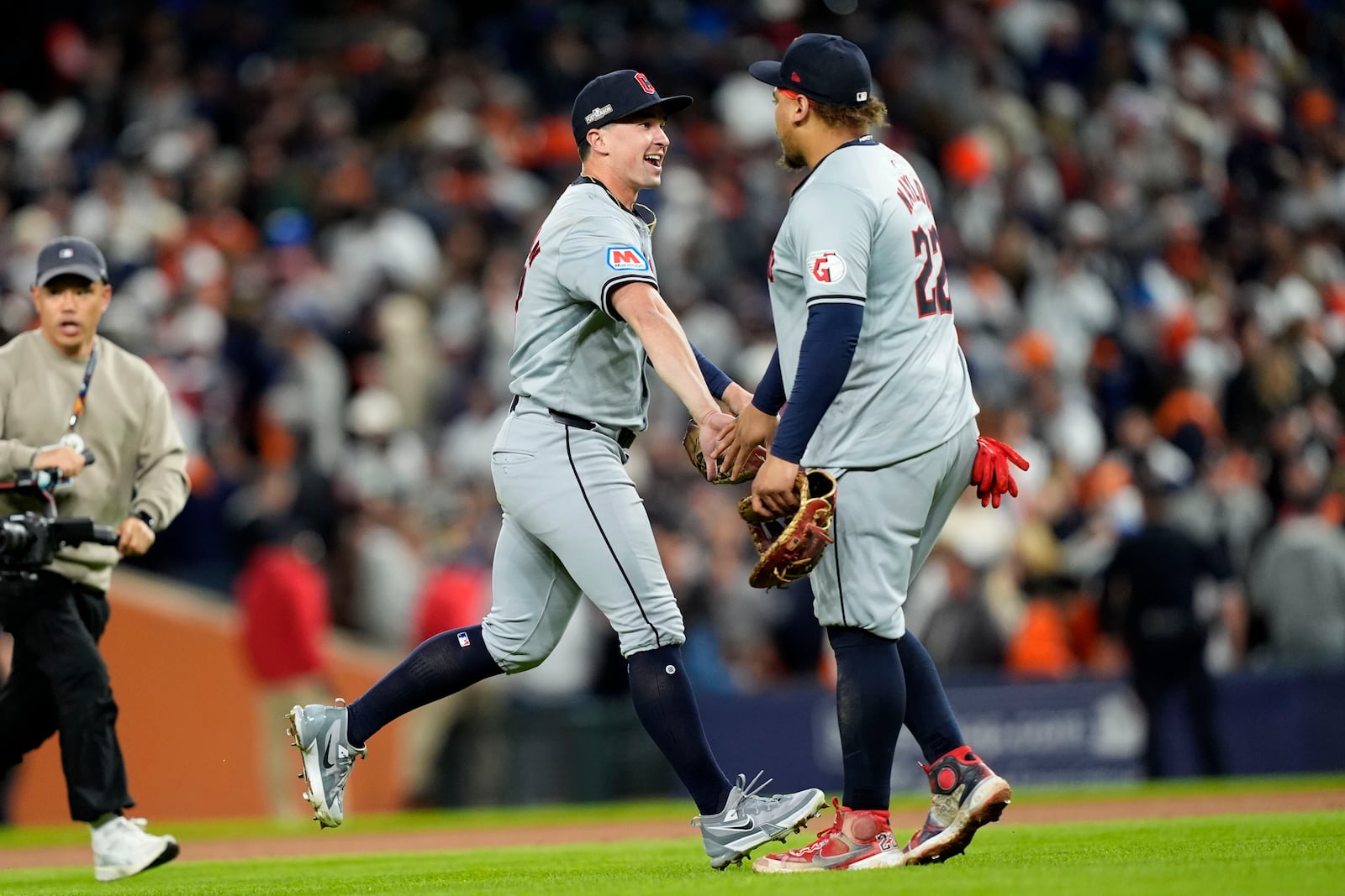 Cleveland Guardians' Will Brennan, left, and Josh Naylor celebrate at the end of Game 4 of a baseball American League Division Series against the Detroit Tigers, Thursday, Oct. 10, 2024, in Detroit. The Guardians won 5-4. (AP Photo/Carlos Osorio)