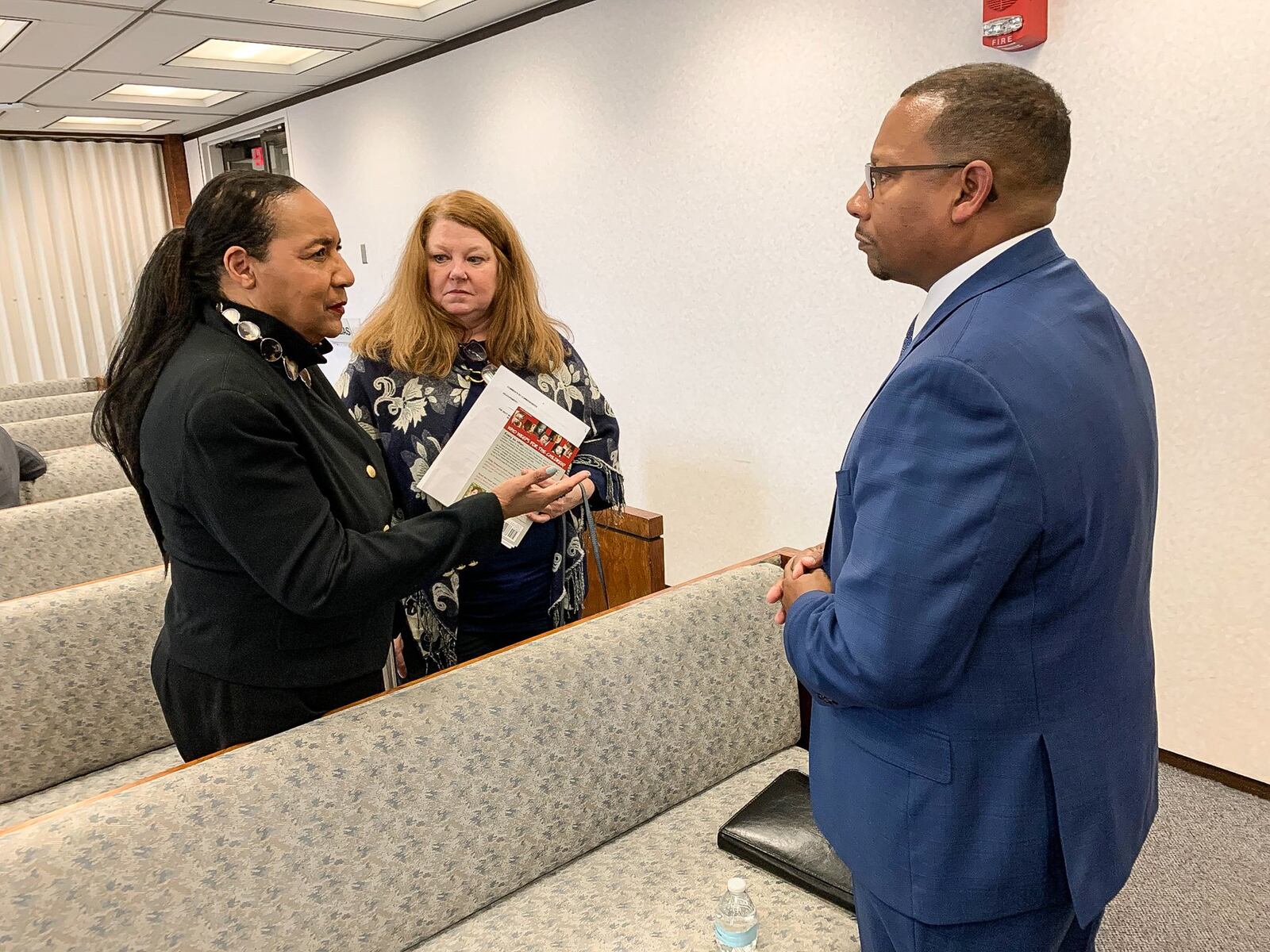 Shirley Stallworth, left, and Polly Parks, members of Takoda’s Call , speak with Montgomery County Administrator Michael Colbert following Tuesday’s county commission meeting. CHRIS STEWART / STAFF