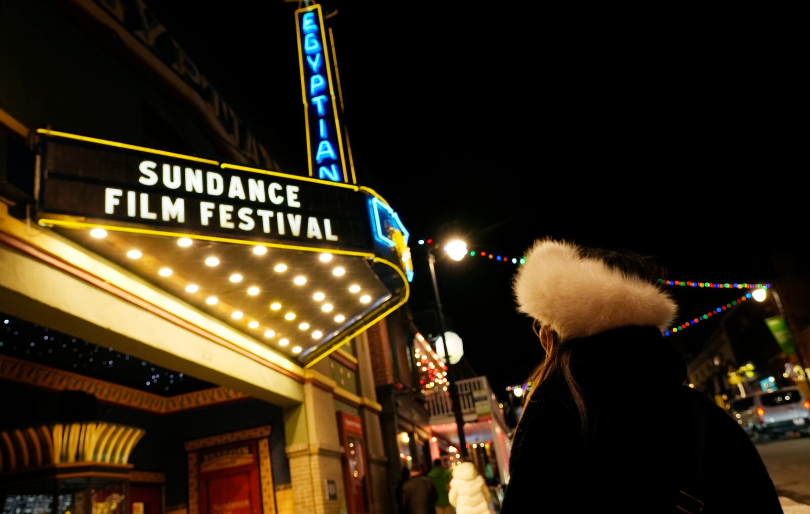 A pedestrian looks up at the marquee of the Egyptian Theater before the start of the 2025 Sundance Film Festival on Wednesday, Jan. 22, 2025, in Park City, Utah. (AP Photo/Chris Pizzello)