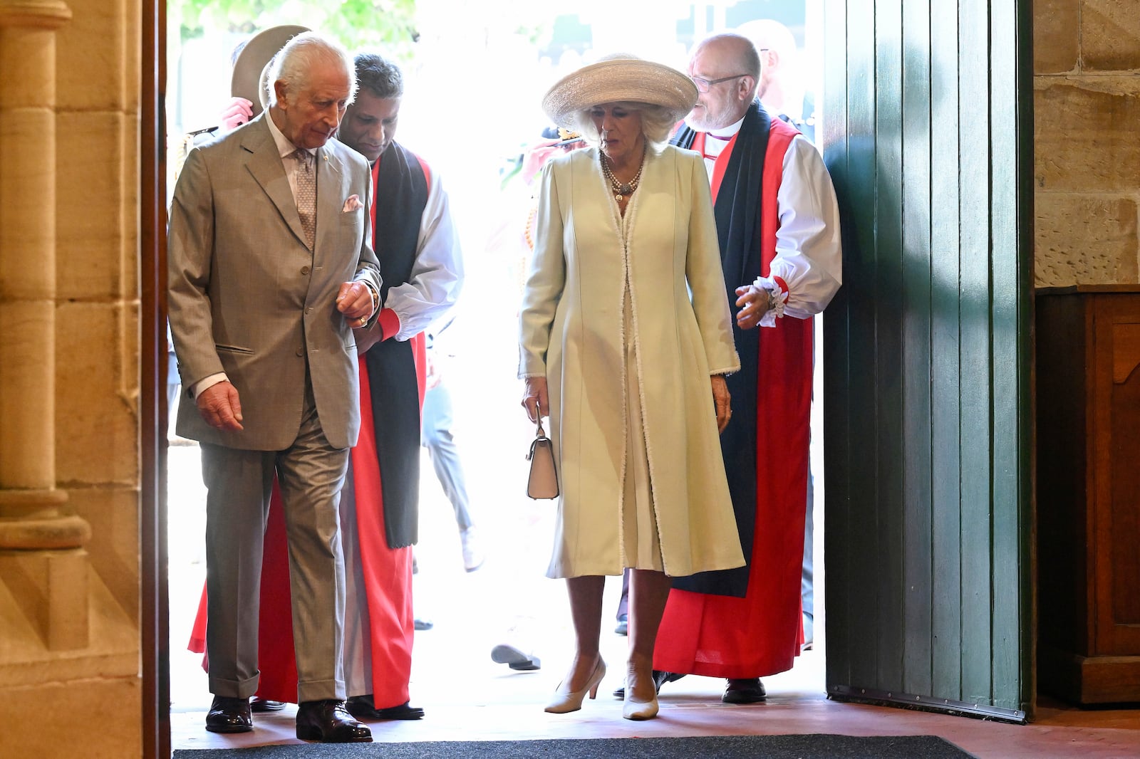 King Charles III, left, and Queen Camilla, center, arrive during a visit to St Thomas' Anglican Church in Sydney, Sunday, Oct. 20, 2024. (Dean Lewins/Pool Photo via AP)