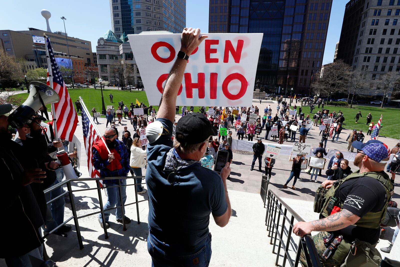 FILE- This Monday, April 20, 2020 file photo shows protesters gathering outside of the Ohio State House in Columbus, Ohio to protest the stay home order. Legislative testimony made Wednesday, Feb. 17, 2021 in support of a GOP-backed effort to limit public health orders made by Ohio's governor was removed from YouTube after the service deemed it contained COVID-19 misinformation. The Google-owned platform said it removed content that was uploaded this week to The Ohio Advocates for Medical Freedom channel for violating the company's terms of services. (AP Photo/Gene J. Puskar, File)