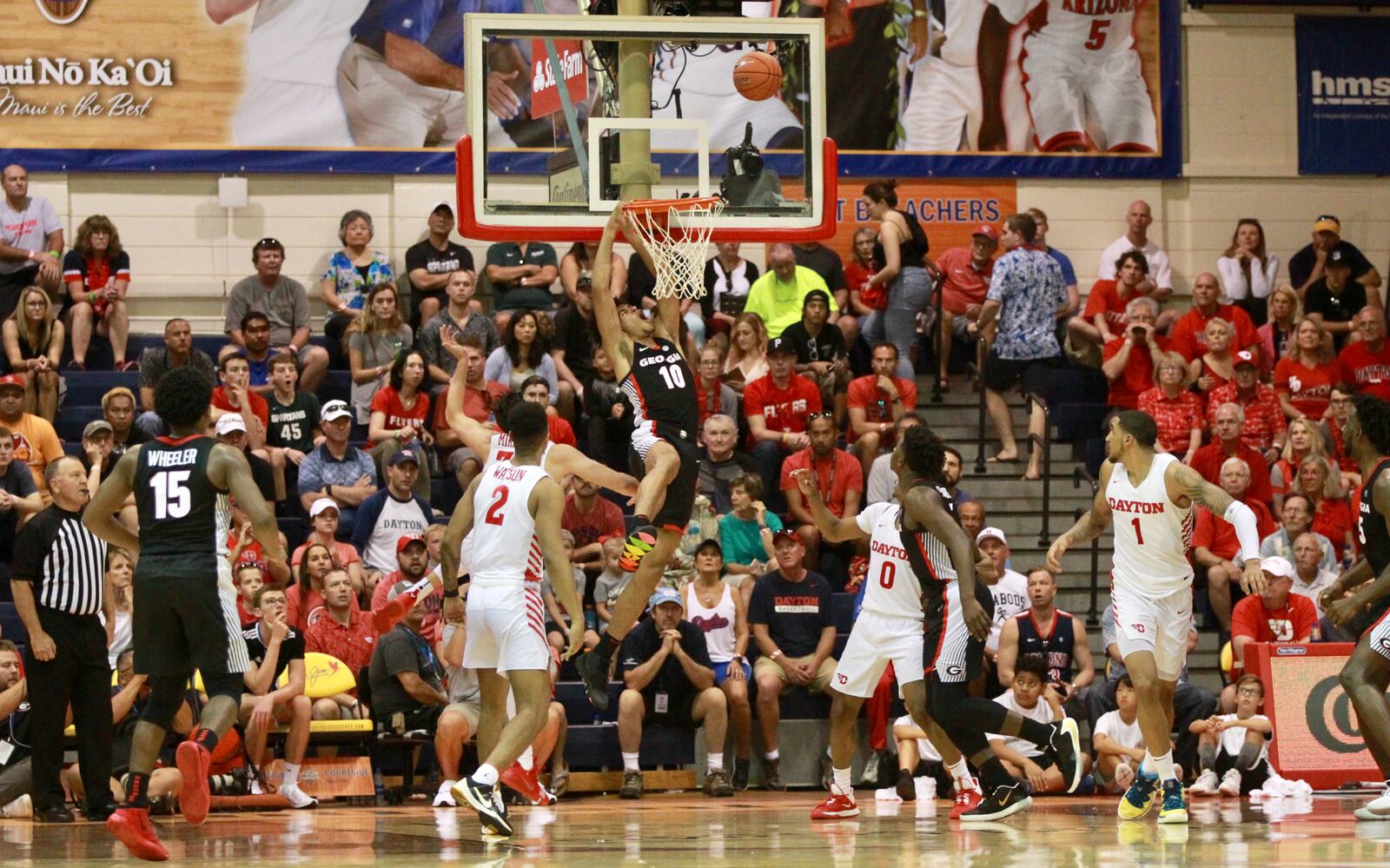 Georgia's Toumani Camara is fouled by Dayton's Ryan Mikesell on Nov. 25, 2019, during the first round of the Maui Invitational. David Jablonski/Staff