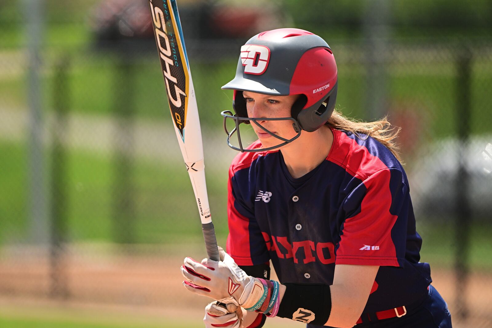 Emma Schutter, of Dayton softball, bats against Massachusetts on May 1 in Dayton. Photo by Erik Schelkun