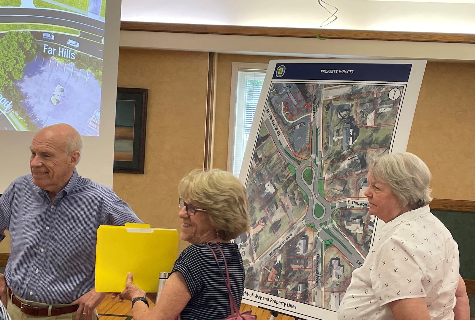 About 70 people attended a Wednesday night forum on a proposed roundabout design on Ohio 48 in Oakwood. The city is considering the plan to improve safety at a six-spoke intersection near the Dayton border. NICK BLIZZARD/STAFF