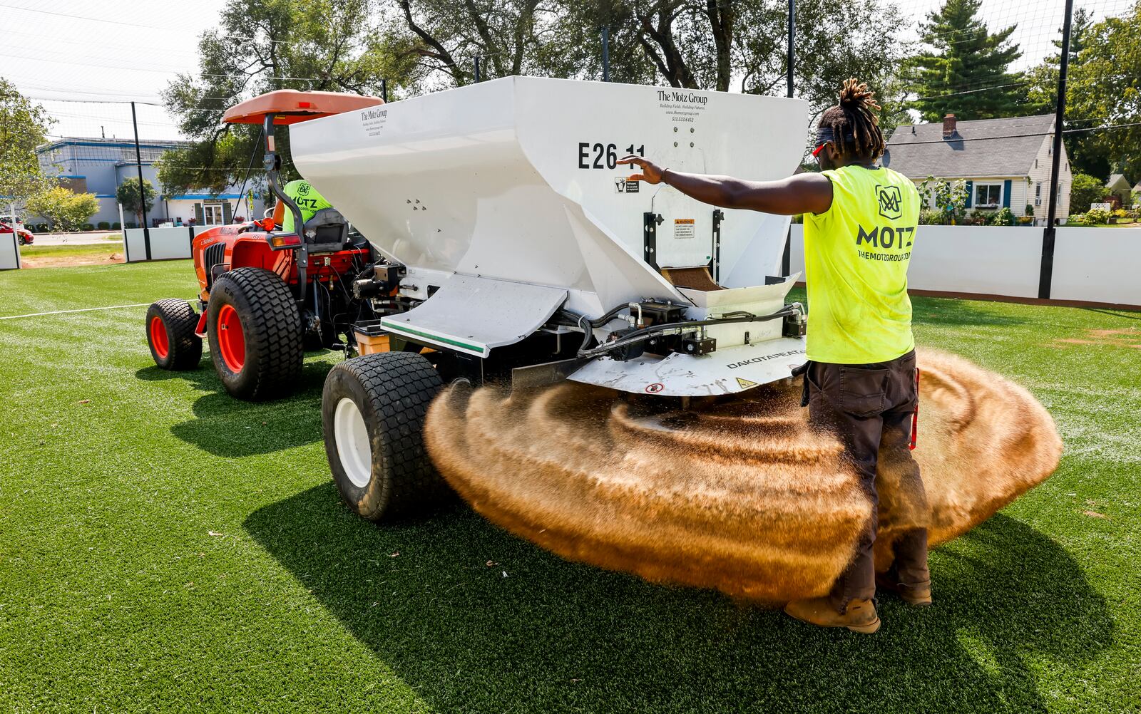 Robert Scott with Motz Group works on a installing a miniature turf soccer field at Douglass Park Wednesday, Aug. 23, 2023 in Middletown. NICK GRAHAM/STAFF