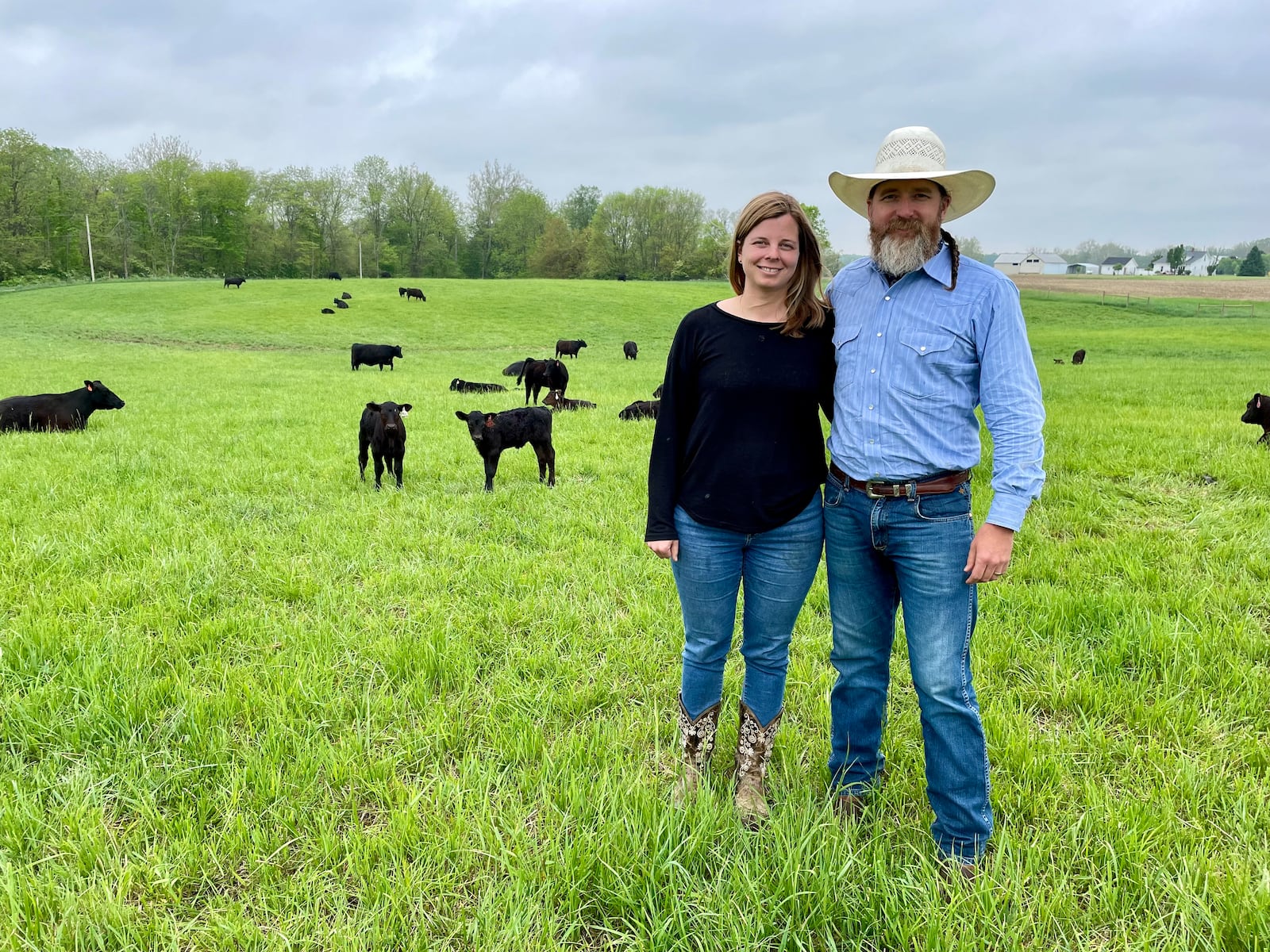 Honey Creek Beef is a closed herd cattle farm located at 6350 Addison-New Carlisle Road, just outside of Champaign County in New Carlisle. Pictured are owners Adam Frantz and his wife, Mia Grimes. NATALIE JONES/STAFF