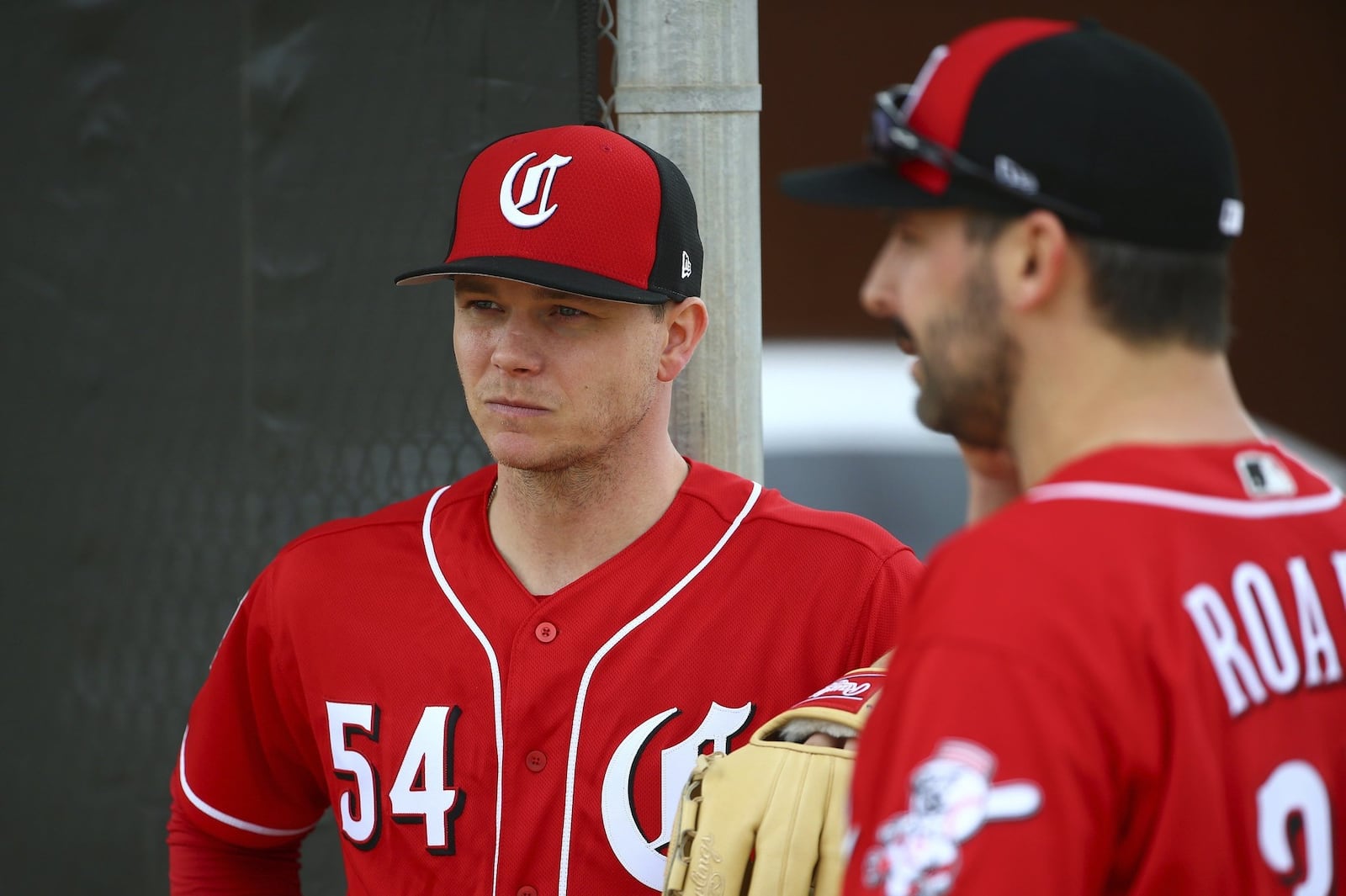 FILE - In this Feb. 13, 2019, file photo, Cincinnati Reds pitcher Sonny Gray (54) and Tanner Roark pause during workouts at the Reds spring training baseball facility, in Goodyear, Ariz. Gray agreed to a trade from the Yankees after deciding he wanted to be part of the Reds’ attempt at a resurgence. Now they have to figure out where he fits in the rotation. (AP Photo/Ross D. Franklin, File)