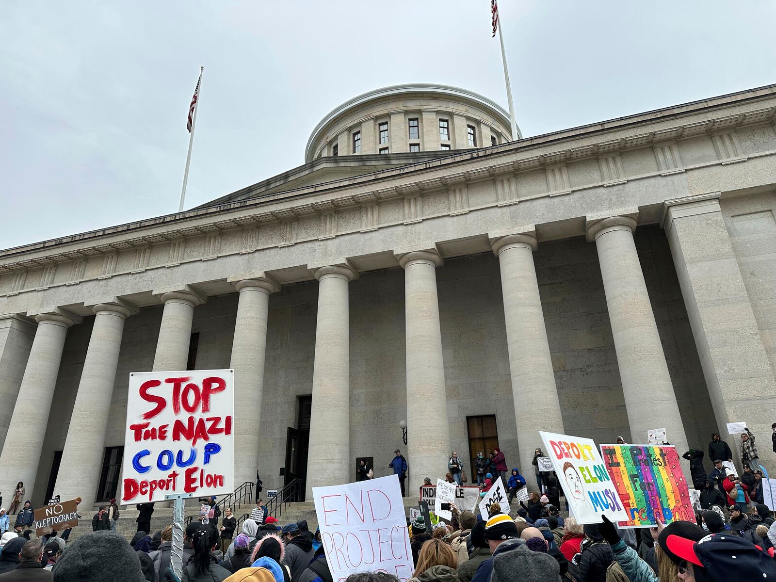 Protesters gather at the Ohio Statehouse in Columbus, Ohio, to demonstrate against the actions of Republican President Donald Trump and billionaire ally Elon Musk. (AP Photo/Julie Carr Smyth)