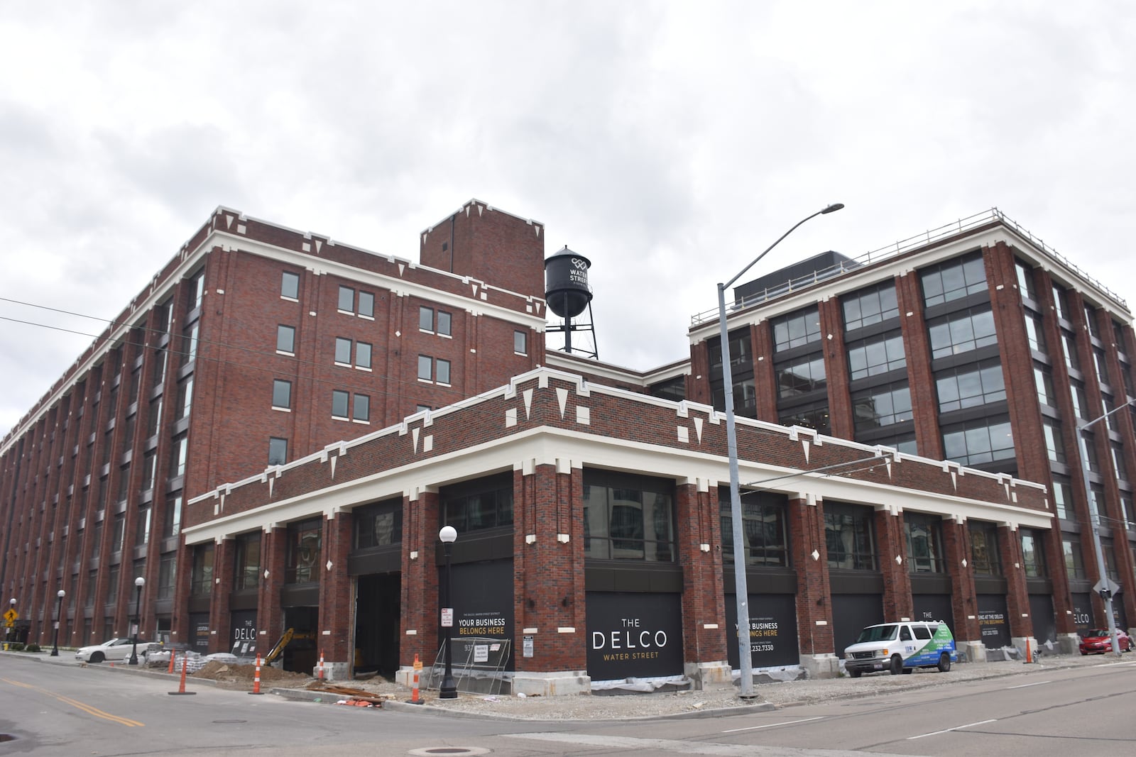 Some of the Delco building, a massive mixed-use development located just south of the Day Air Ballpark in downtown, is expected to open in June. The rest of the building is expected to open by the end of summer, possibly by the end of August. CORNELIUS FROLIK / STAFF