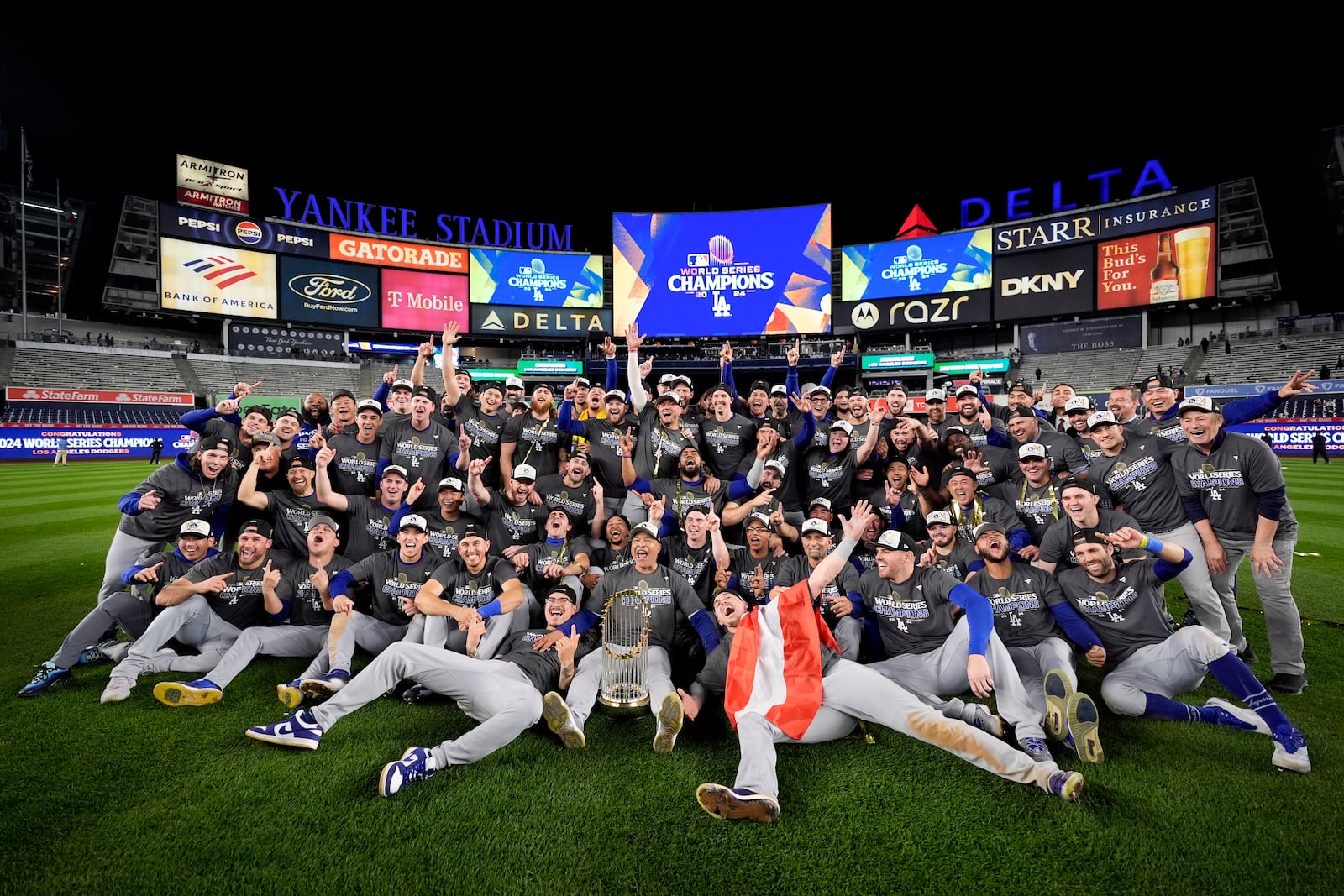 The Los Angeles Dodgers pose for a team picture after their win against the New York Yankees in Game 5 to win the baseball World Series, Thursday, Oct. 31, 2024, in New York. (AP Photo/Ashley Landis)