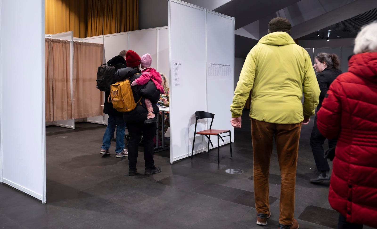 People prepare to cast their ballots in the Iceland election at a polling station, at Reykjavik city hall, Iceland, Saturday, Nov. 30, 2024. (AP Photo/Marco Di Marco)