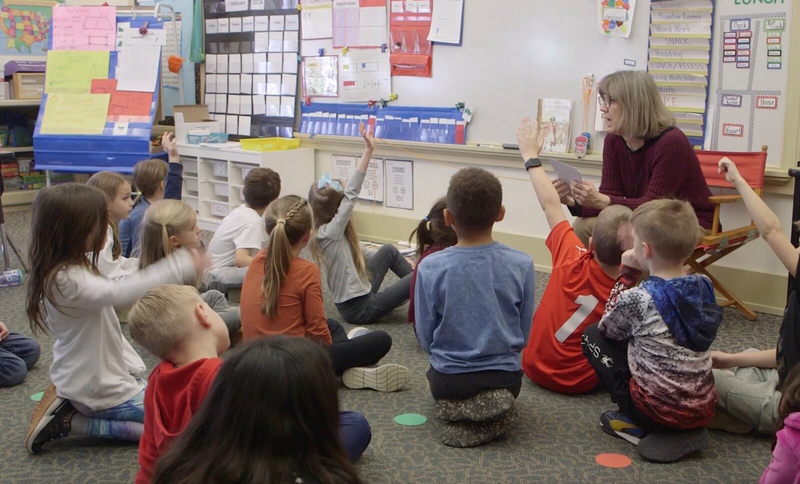 First-grade teacher Jennifer Davis works with students on learning shapes. Eighty percent of those surveyed recently rated the quality of education in the district as excellent. CONTRIBUTED