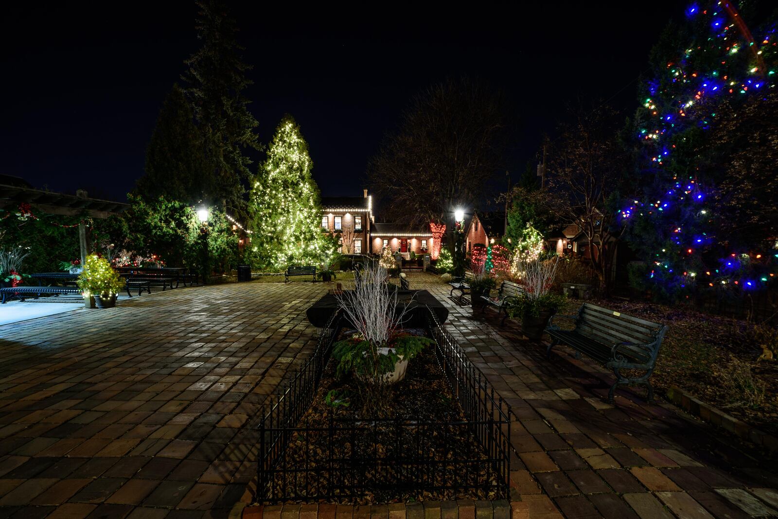 German Village, a historic neighborhood located south of downtown Columbus, was added to the National Register of Historic Places in 1974. In 2011, the American Planning Association named German Village one of the Great Places in America in the Neighborhoods category. Frank Fetch Park, Lindey's Restaurant & Bar, neighborhood homes and The Umbrella Girl sculpture in Schiller Park, who is mysteriously draped in a red cloak are decorated for the holiday season. TOM GILLIAM / CONTRIBUTING PHOTOGRAPHER