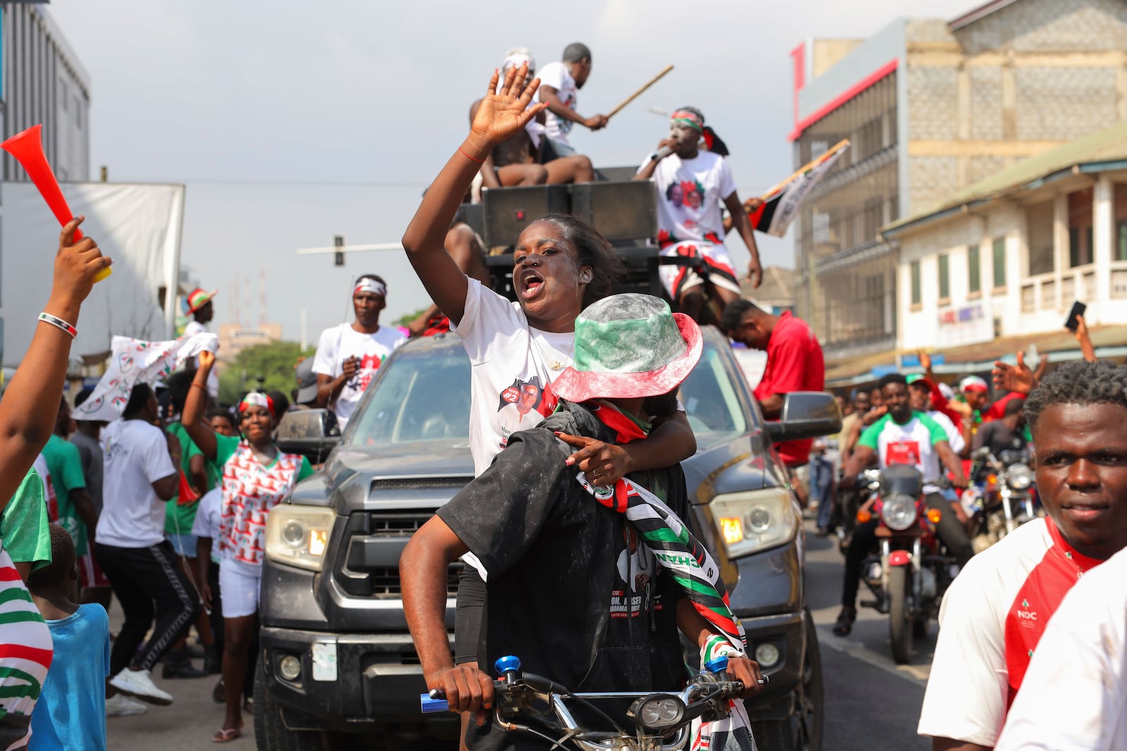 Supporters of opposition candidate and former President John Dramani Mahama celebrate their victory after Ghana's vice president and ruling party candidate, Mahamudu Bawumia conceded his defeat in Accra, Ghana, Sunday, Dec. 8, 2024. (AP Photo/Misper Apawu)