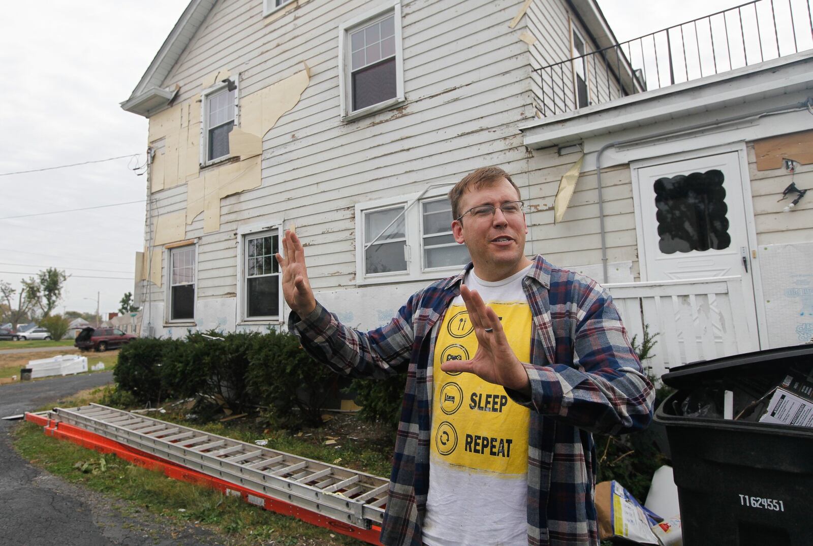 Stefan Kempf is repairing his own Dayton home damaged in the tornado and may look to invest in nearby properties to help his neighborhood on the border with Harrison Twp. recover. CHRIS STEWART / STAFF