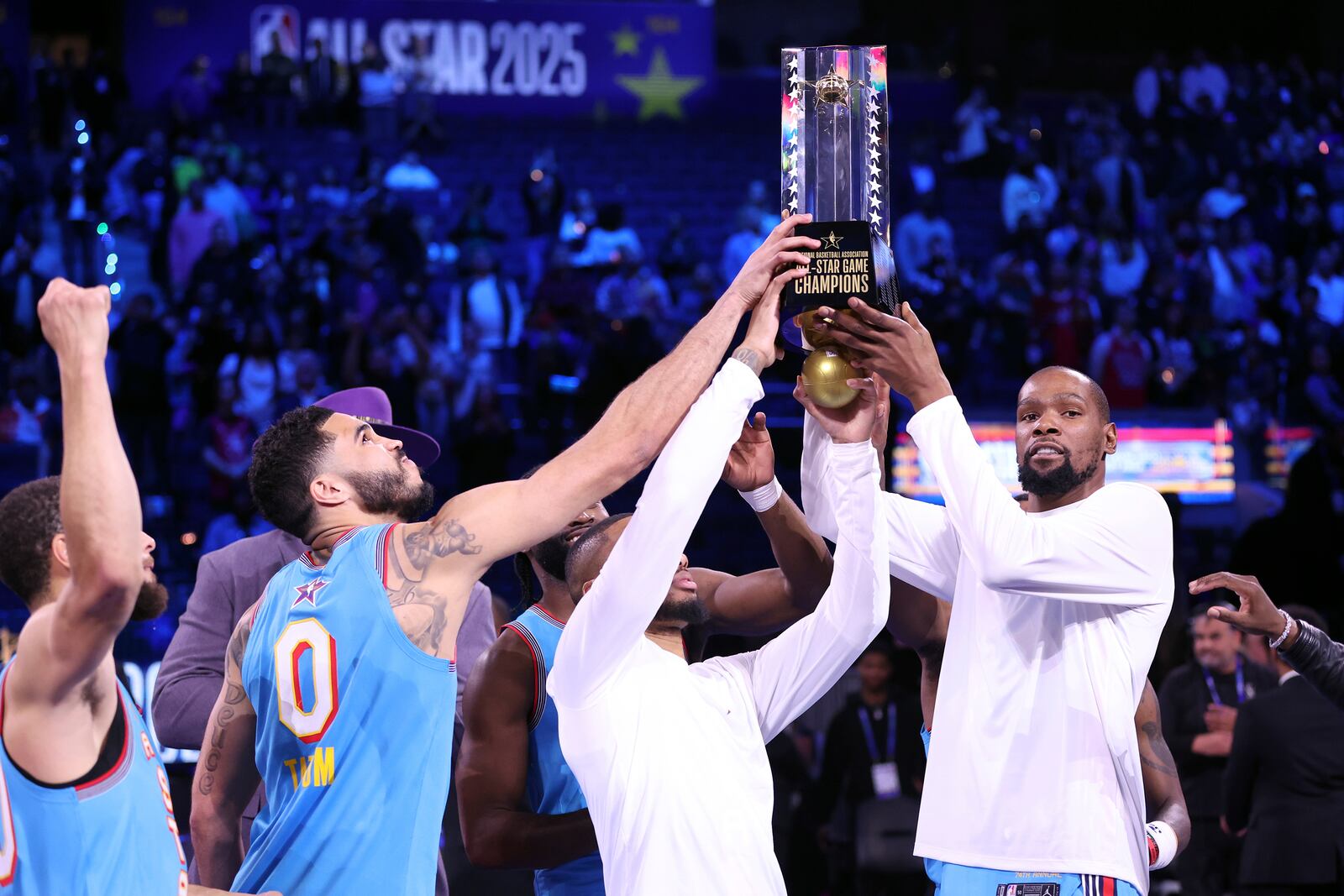 Team Shaq's Kevin Durant, Damian Lillard, Jayson Tatum and Stephen Curry hold up the championship trophy following the 74th NBA All-Star Game in San Francisco, Sunday, Feb. 16, 2025. (Scott Strazzante/San Francisco Chronicle via AP)