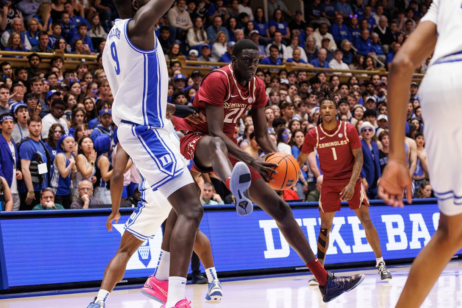 Florida State's Alier Maluk (21) handles the ball as Duke's Khaman Maluach (9) defends during the first half of an NCAA college basketball game in Durham, N.C., Saturday, March 1, 2025. (AP Photo/Ben McKeown)