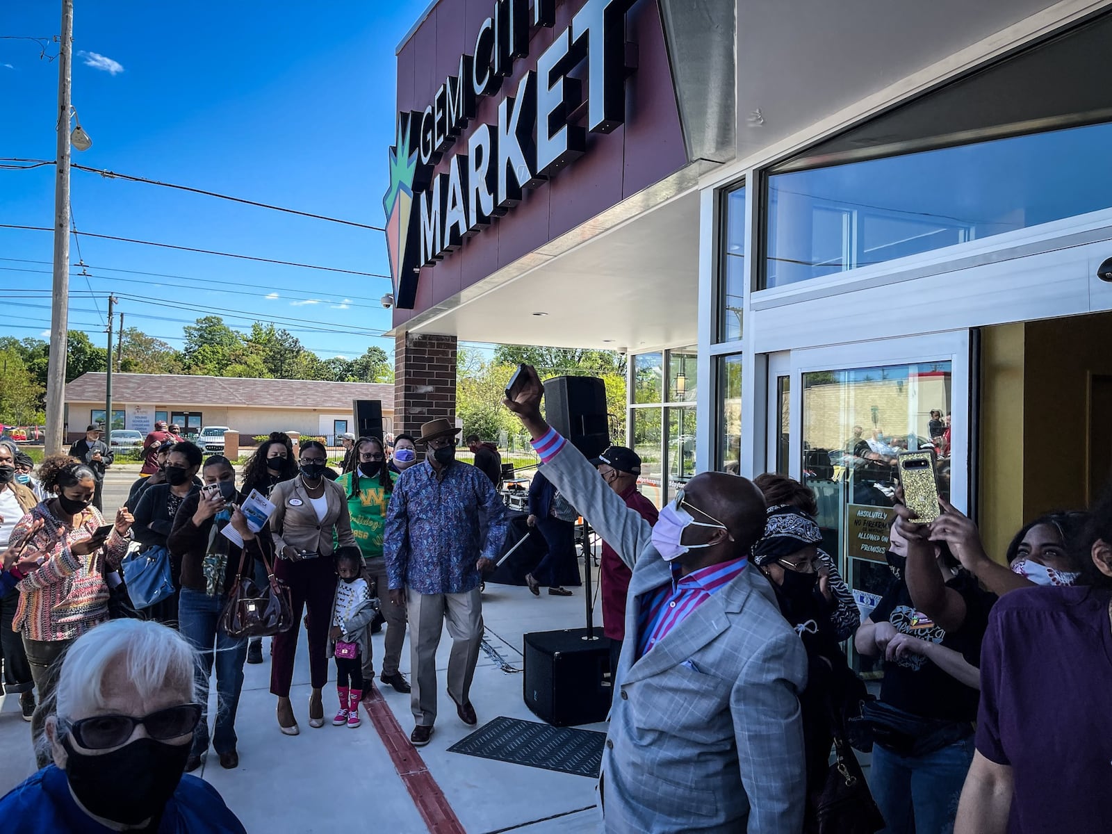 More than 175 people applauded when the Gem City Market opened for business on Wednesday, May 12, 2021 a sign that it’s more than just a grocery store ― it’s a community-led movement, an oasis in the middle of a major food desert and a major investment in an area that has been underserved. JIM NOELKER/STAFF