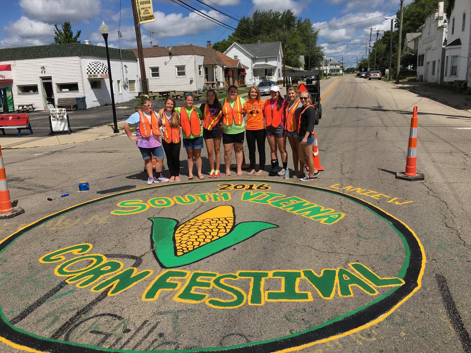 The candidates for the South Vienna Corn Festival queen contest paint the street ahead of the event. Contributed photo