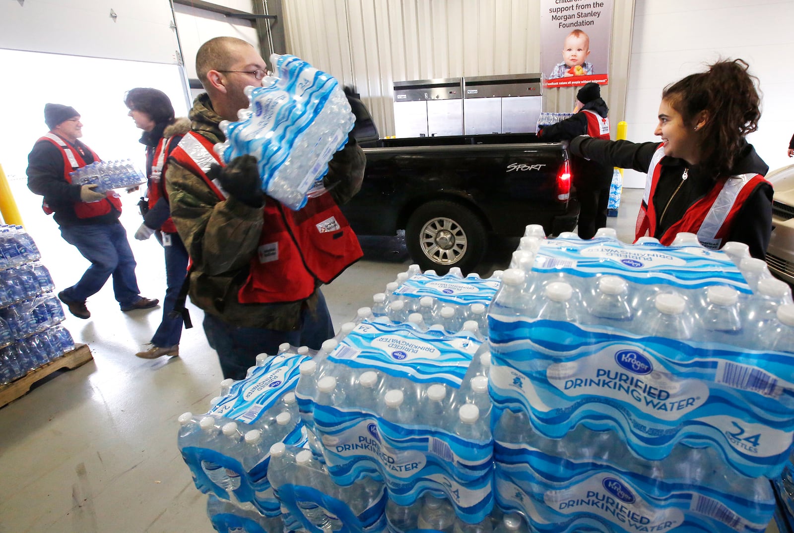 Free water distribution was at The Foodbank in Dayton after a boil advisory was issued in February due to a water main break.   TY GREENLEES / STAFF