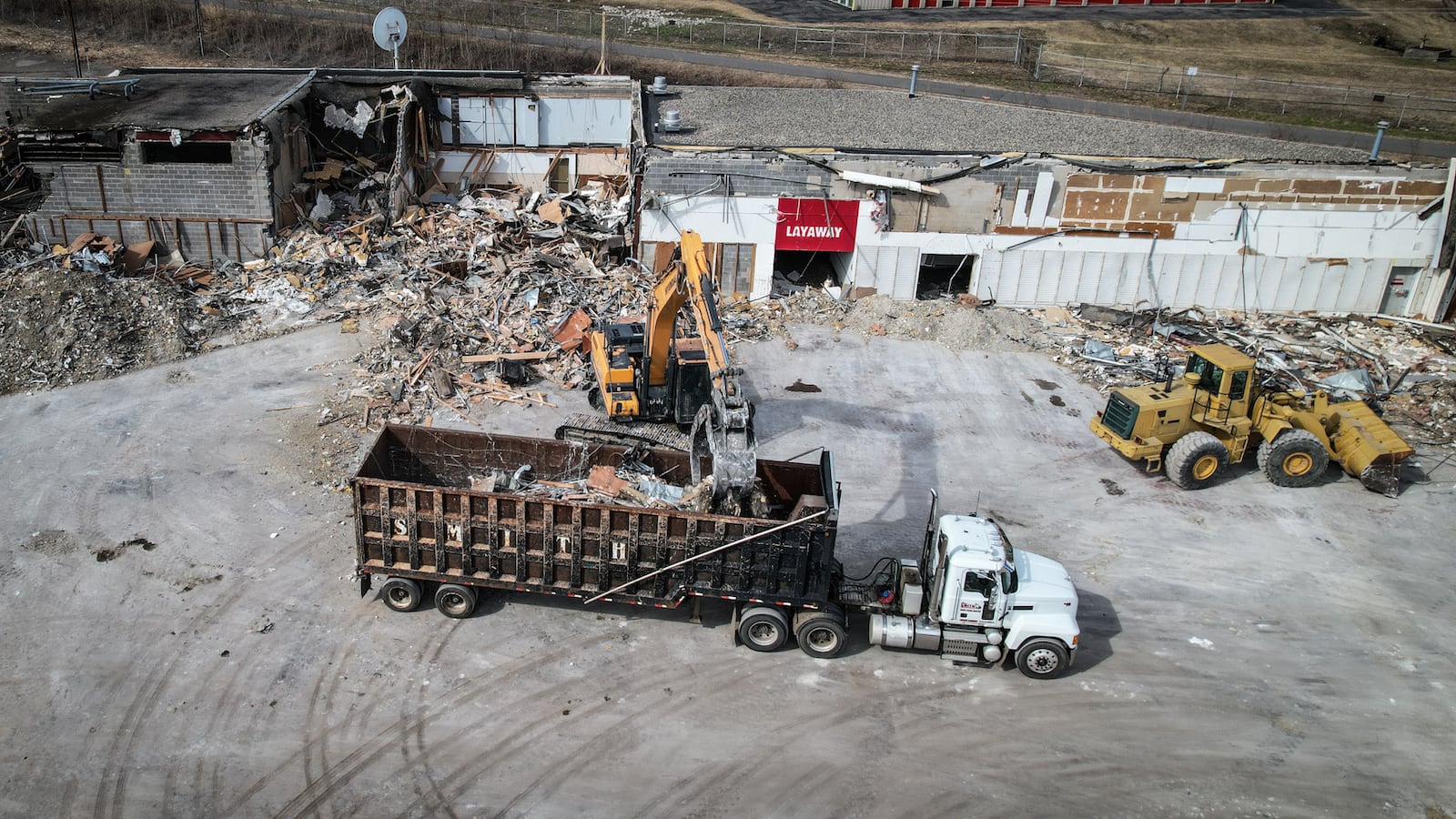 Crews Thursday were tearing the site of a former Kmart at Woodman Drive and Burkhardt Road where officials have said Kroger plans a $23 million location that will include about 160 jobs.