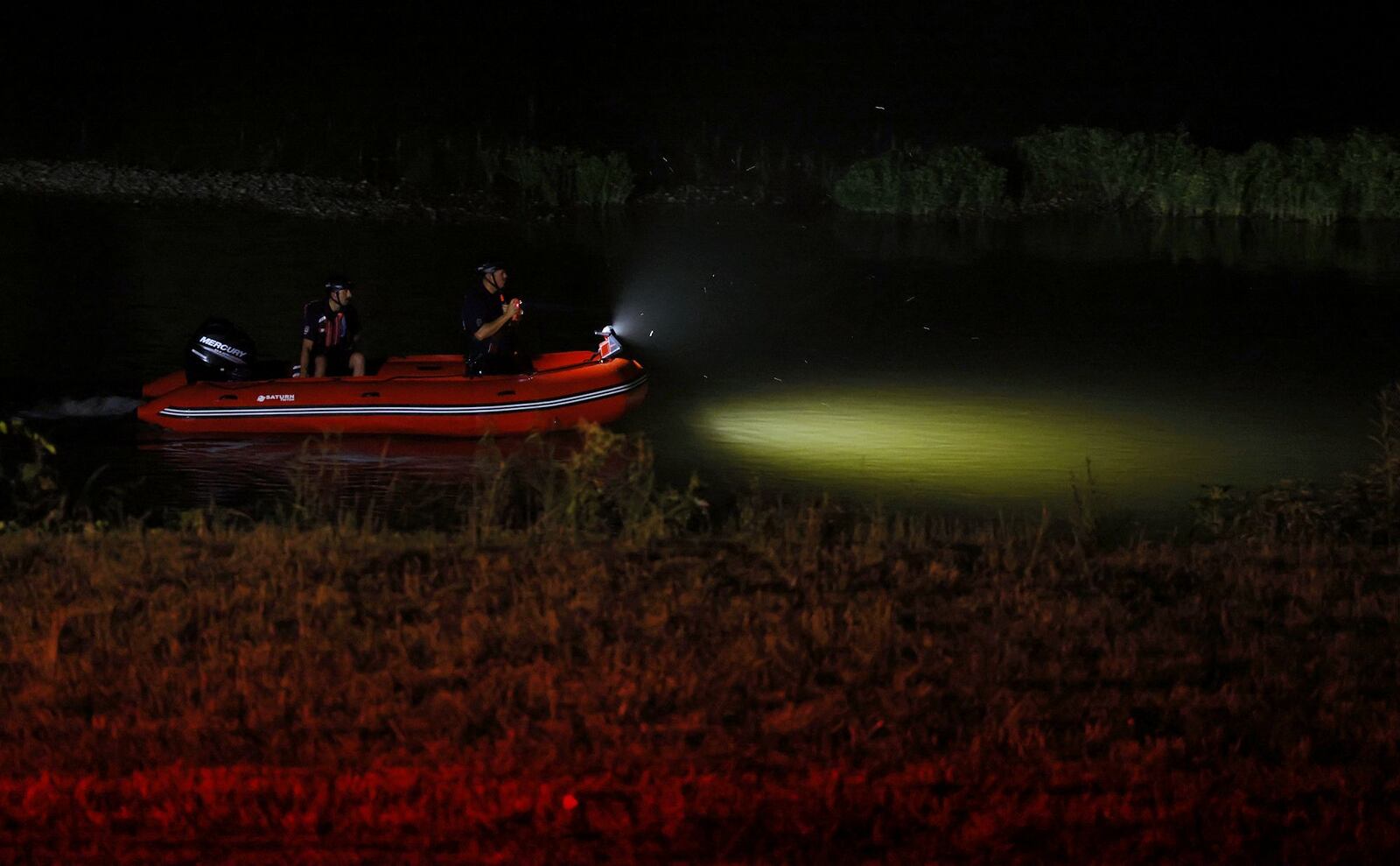 Middletown and Monroe rescue workers searched the Great Miami River north of Germantown Road bridge early Saturday morning on a report a person went into the water and needed rescue help. NICK GRAHAM/STAFF PHOTO