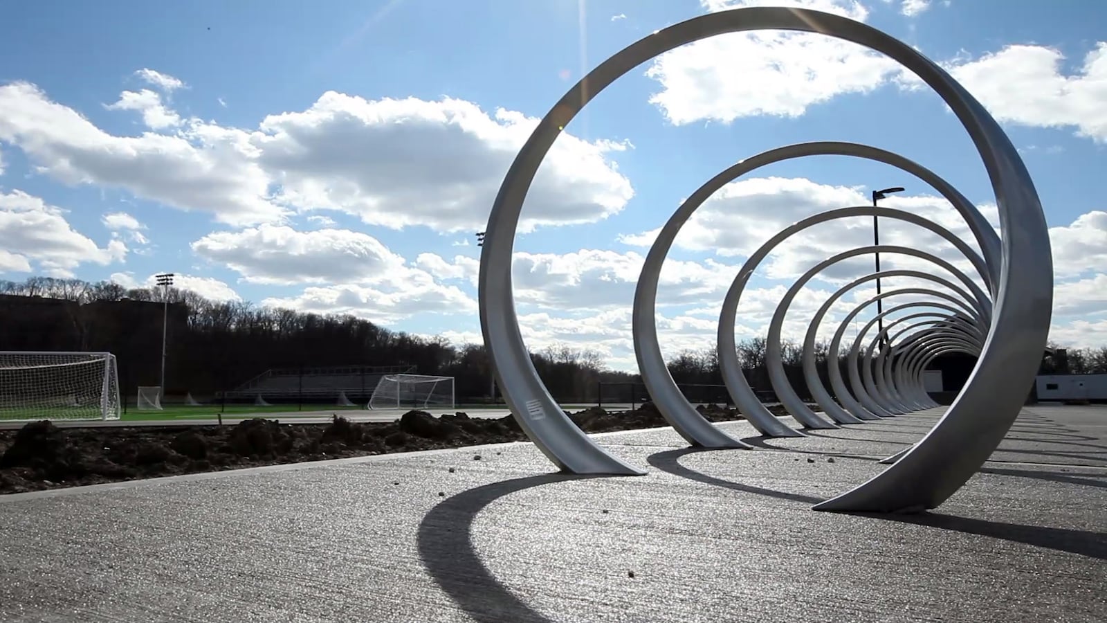 For the first time in school history, Oakwood High School will now have a dedicated sports facility to accommodate soccer, field hockey, boys and girls lacrosse and track. Metal sculpture bicycle rack at Oakwood's Lane Stadium.  TY GREENLEES / STAFF