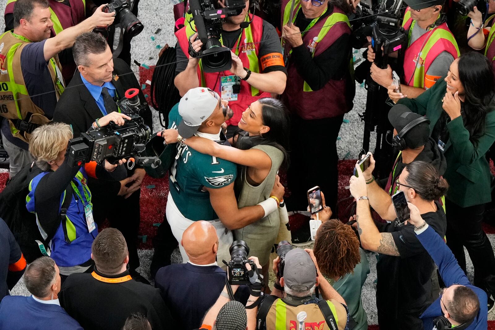 Philadelphia Eagles quarterback Jalen Hurts (1) hugs his partner Bryonna Burrows after the NFL Super Bowl 59 football game, Sunday, Feb. 9, 2025, in New Orleans. (AP Photo/Godofredo A. V·squez)