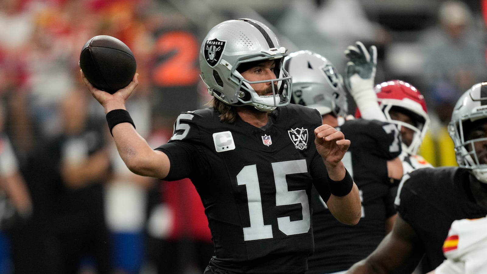 Las Vegas Raiders quarterback Gardner Minshew (15) throws during the first half of an NFL football game against the Kansas City Chiefs Sunday, Oct. 27, 2024, in Las Vegas. (AP Photo/John Locher)