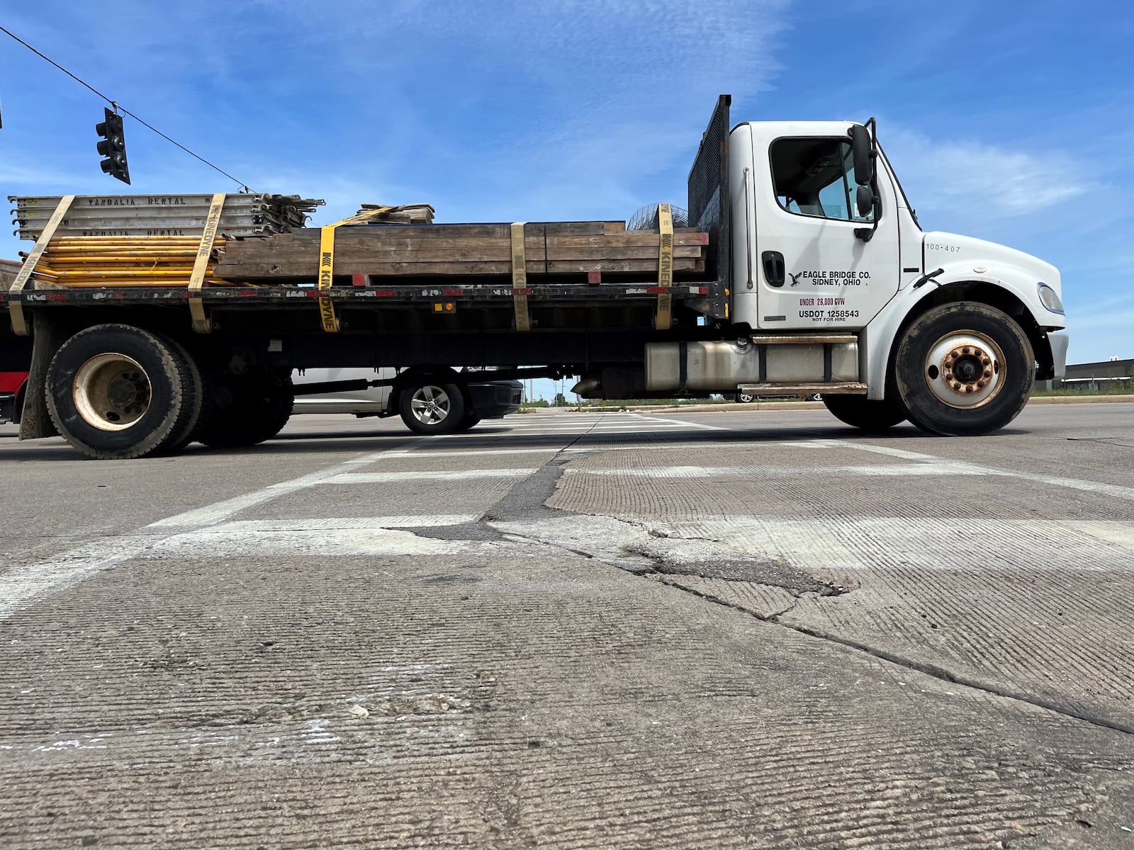 A truck zips along U.S. 35 at the Abbey Avenue intersection. Some safety upgrades have been made to help pedestrians, like a new striped crosswalk. CORNELIUS FROLIK / STAFF