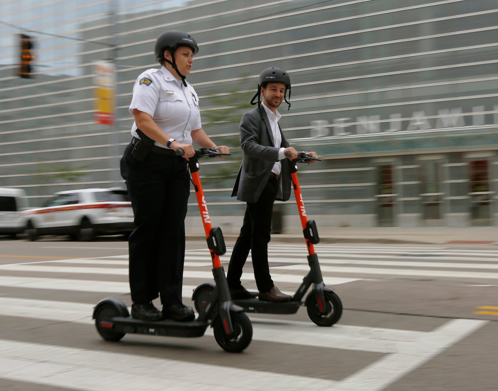 Spin Electric Scooters provide a great way to zip around downtown Dayton. File photo by TY GREENLEES / STAFF