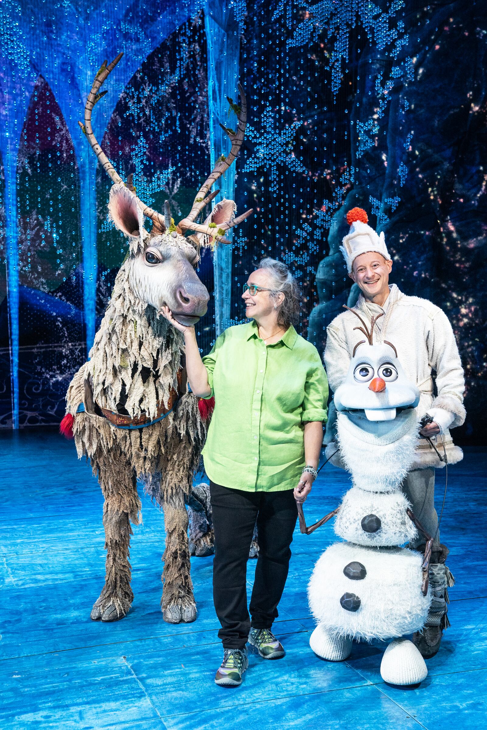 Sue McLaughlin, center, is the puppet supervisor with "Frozen.'' She is flanked by actor Collin Baja, wearing the Sven puppet costume, and Jeremy Davis who portrays Olaf. CONTRIBUTED PHOTO