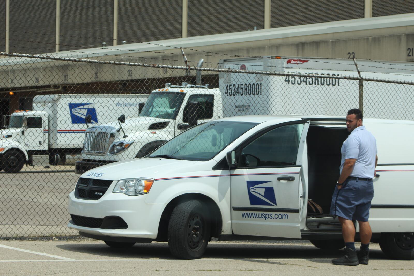 A U.S. Postal Service employee outside of the Dayton mail processing and distribution facility on East Fifth Street. CORNELIUS FROLIK / STAFF